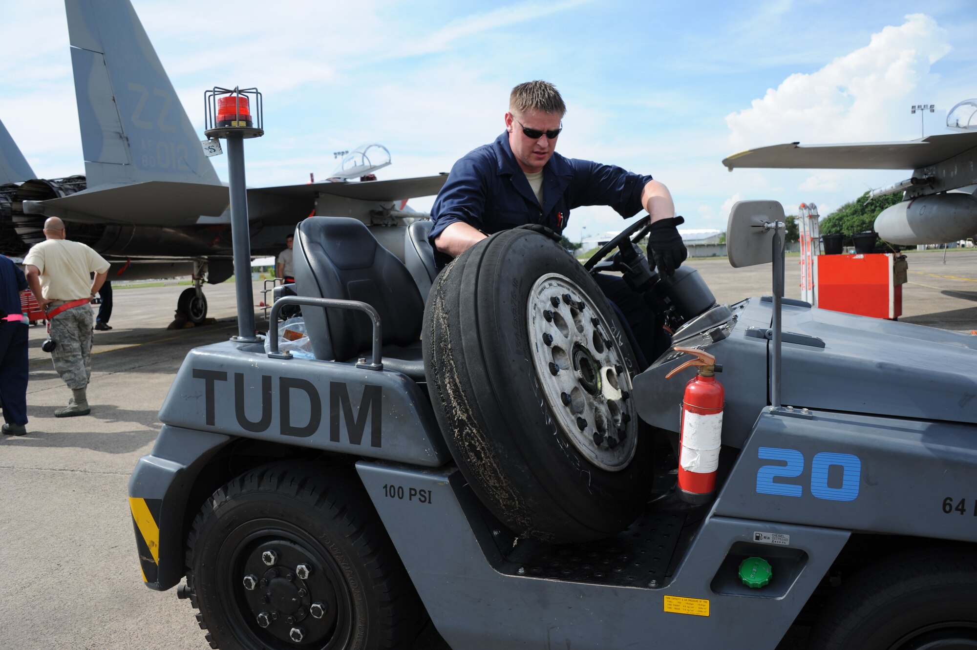 Tech. Sgt. Aron Kerzic, 18th Component Maintenance Squadron fuel systems craftsman from Kadena Air Base, Japan, transports a worn main landing gear tire from the flightline during Cope Taufan 2012 at TUDM Butterworth on April 9, 2012.  Cope Taufan is a live-flying exercise designed around dissimilar basic fighter maneuvers and dissimilar air combat tactics training between the U.S. Air Force and Royal Malaysian Air Force. (U.S. Air Force photo/Master Sgt. Matt Summers) 