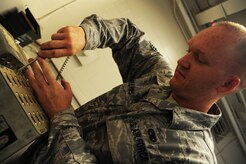 Senior Airman David Collins processes flares at the Joint Base Charleston - Air Base Munitions supply April 10. Flares are used on aircraft to deter incoming bombs. Collins is a munitions control technician with the 437th Maintenance Group Munitions office. (U.S. Air Force photo/Staff Sgt. Katie Gieratz) (Released)