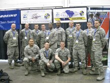 Airmen from the 437th Maintenance Group at Joint Base Charleston - Air Base pose in front of their two teams’ banners during the Aircraft Maintenance Technology Skills Competition March 7 through 9 in Las Vegas. The two JB Charleston teams competed against 135 other competitors in 16 different events spanning five different categories. Team 1, “Ace’s of Maintenance,” placed third overall in the military portion of the competition. (Courtesy photo)