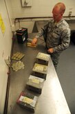 Senior Airman David Collins processes flares at the Joint Base Charleston - Air Base Munitions Center April 10. Collins is a munitions control technician with the 437th Maintenance Group Munitions office. (U.S. Air Force photo/Staff Sgt. Katie Gieratz) 

