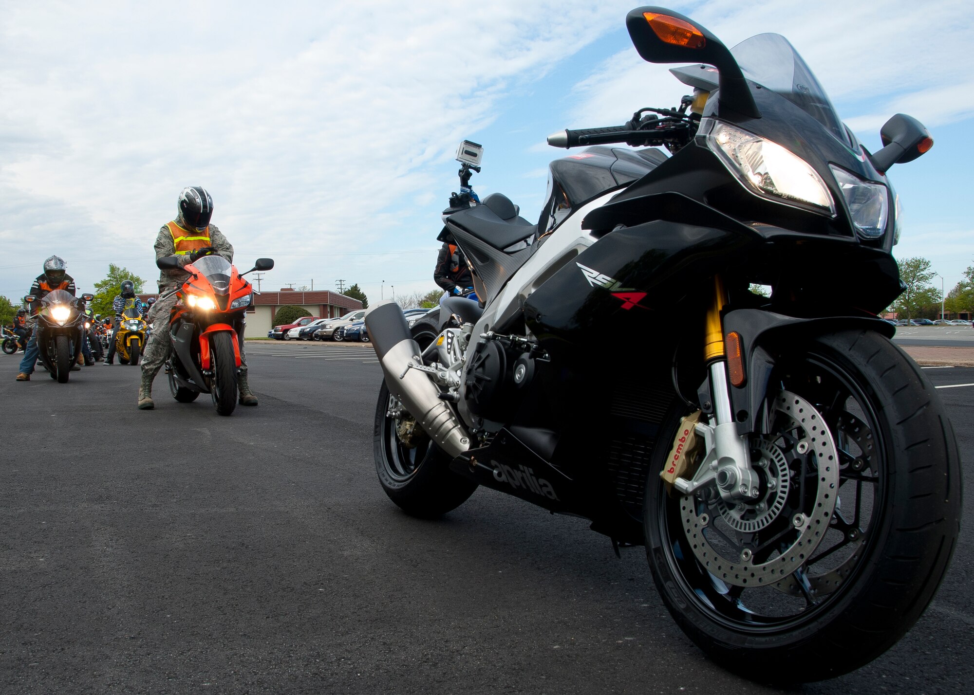 An Aprillia RSV-4 sits in the lead road captain spot at the start of the Sexual Assault Prevention Response Awareness Month Road Rally ride April 6 at the Langley Air Force Base, Va., Community Activity Center. In keeping with the mantra of “safety first,” each motorcycle was inspected for possible safety hazards prior to the ride. (U.S. Air Force photo by Senior Airman John D. Strong II/Released)