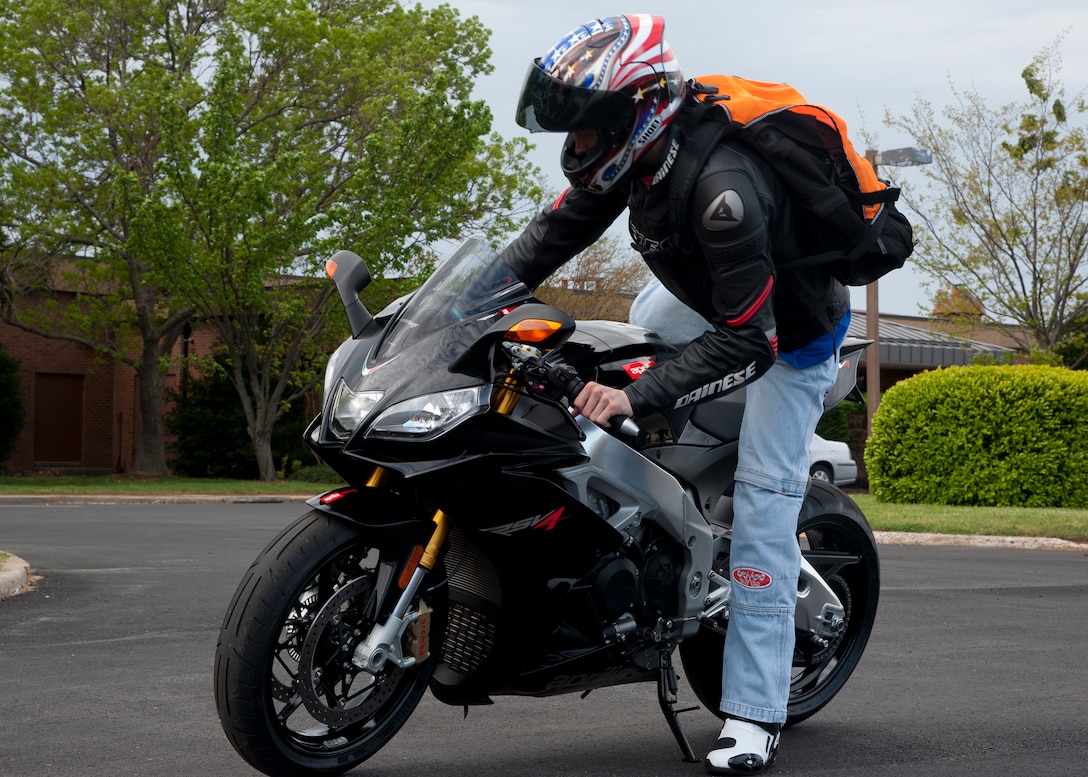 U.S. Air Force Master Sgt. Robert Medivilla, 633rd Medical Group first sergeantr, mounts his Aprillia RSV-4 during the Sexual Assault Prevention Response Awareness Month road rally April 6 at the Langley Air Force Base, Va., Community Activity Center. Medivilla served as the lead road captain for the ride. (U.S. Air Force photo by Senior Airman John D. Strong II/Released)