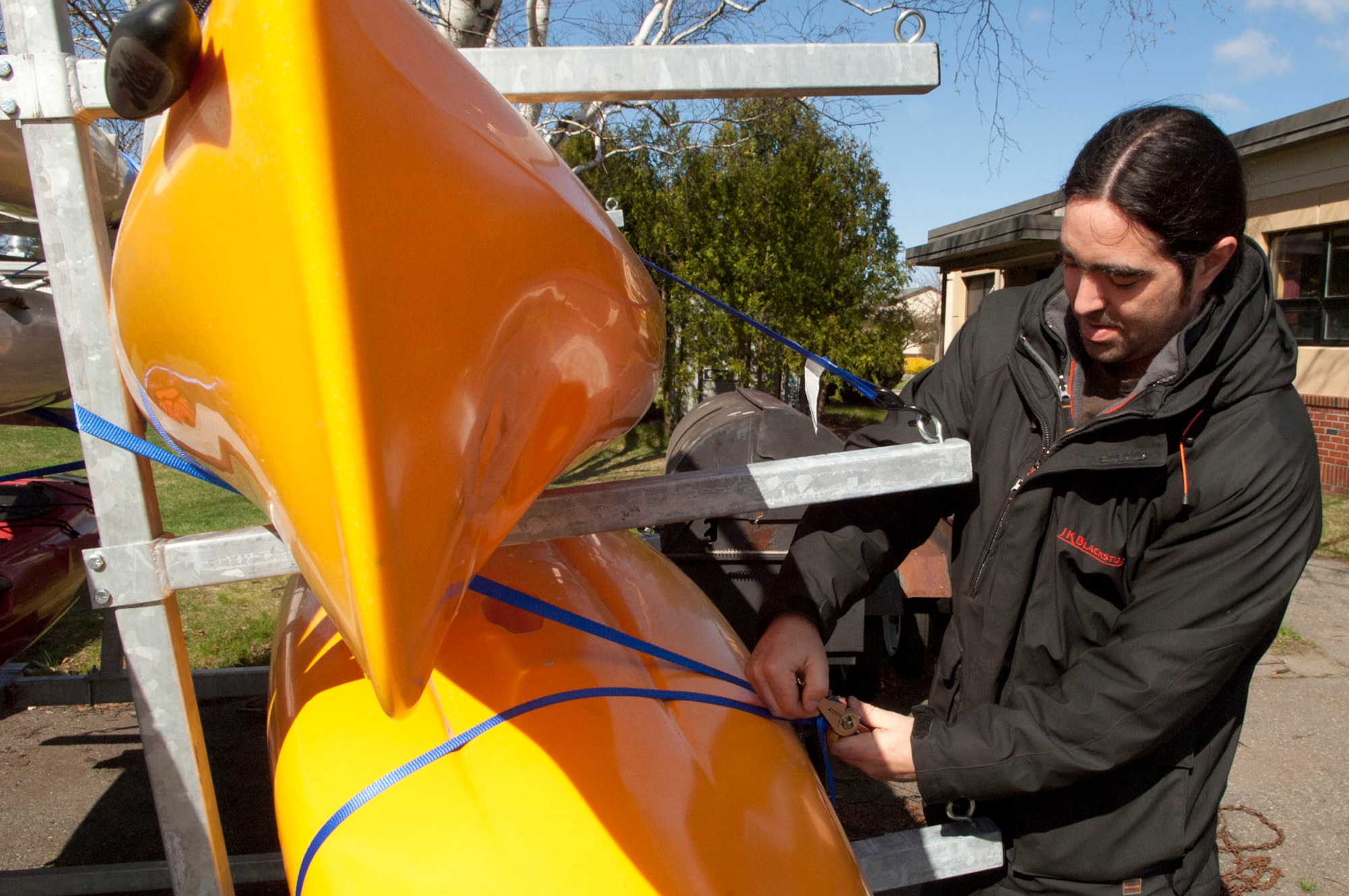 HANSCOM AIR FORCE BASE, Mass. – With spring here and warmer weather coming, Brad Lavoie, an outdoor recreation aid, prepares newly purchased Hobie Kayaks for rental at Outdoor Recreation March 30. Outdoor Recreation has a wide range of sporting, camping, boating and party equipment now available for the Hanscom community to rent. (U.S. Air Force photo by Mark Wyatt)