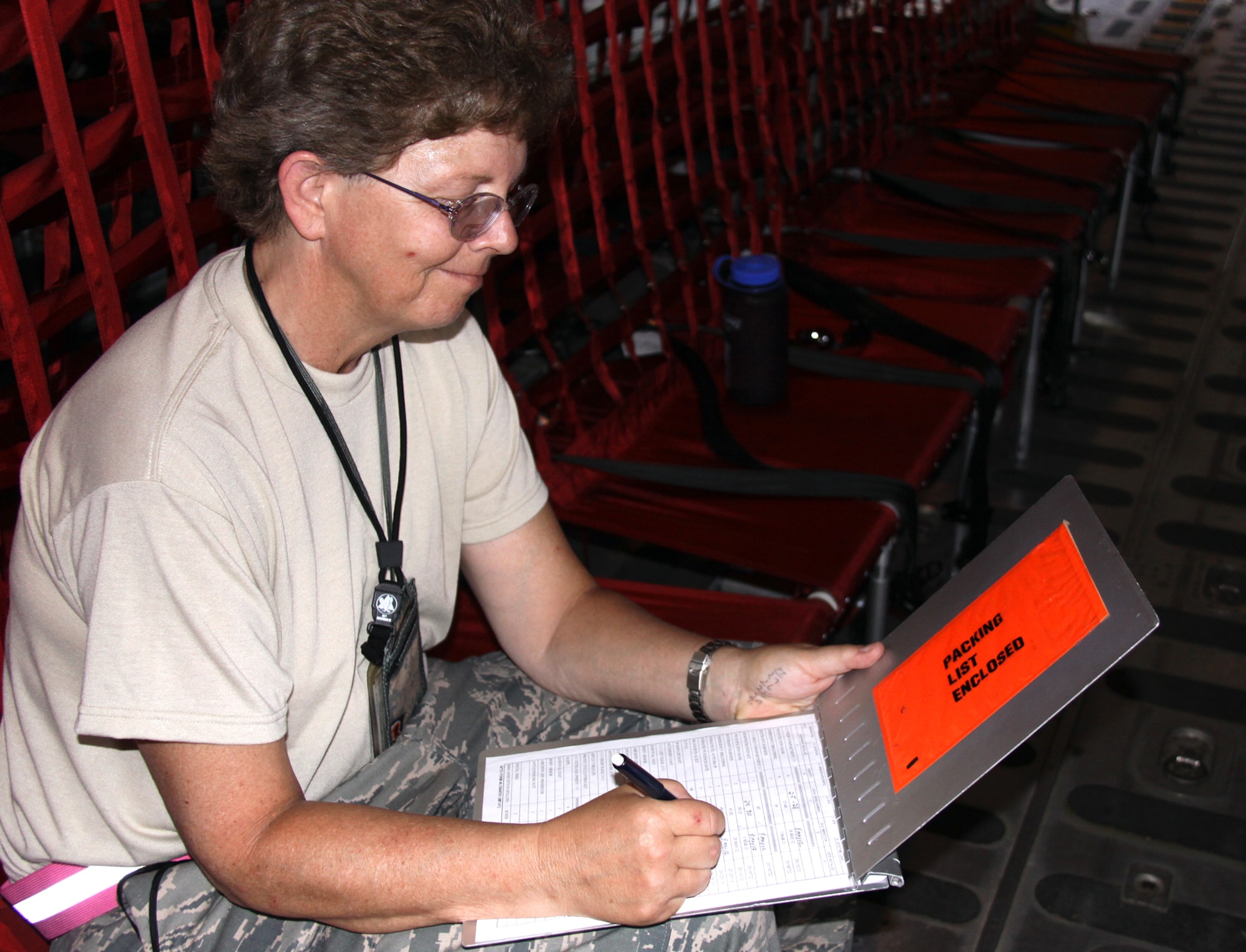 Tech. Sgt. Cindy Baum, a 911th Operations Support Squadron flight equipment technician, goes over a 30-day aircraft equipment inspection, April 9, 2012.  The 30-day equipment inventory was performed in conjunction with an early morning preflight inspection prior to the sealing of the aircraft in order for it to be placed in an alert status. Two C-130s and three aircrews, including maintenance and support staff from the 911th Airlift Wing, are currently deployed in support of 'Coronet Oak' operations based out of Muniz Air National Guard Base, Puerto Rico. (U.S. Air Force photo by Capt. Shawn M. Walleck/Released)