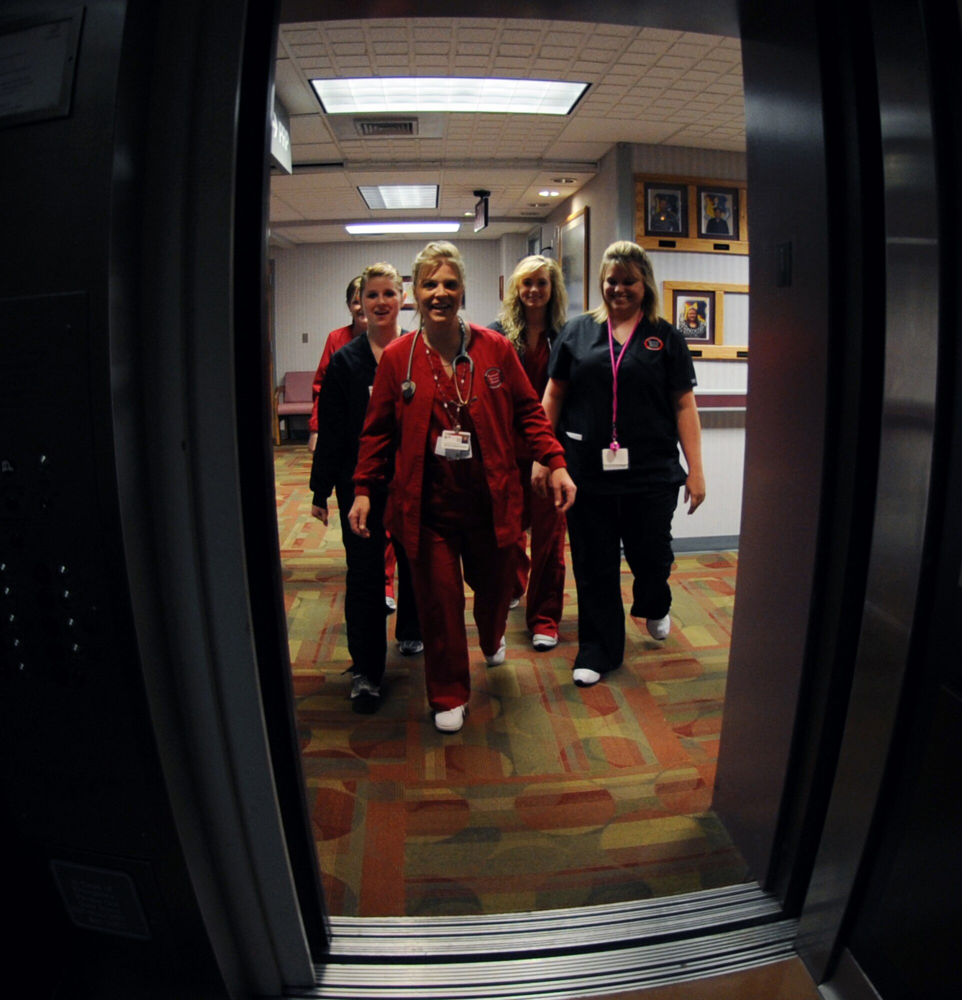 WHITEMAN AIR FORCE BASE, Mo. -- Warrensburg Area Career Center nursing students board an elevator to go to their individual stations while completing the final portion of their education, clinical and patient care April 4. Several local nursing students were selected to participate in a clinical rotation program designed to help educate local students with patient care while members from the 509th Medical Group gained a sense of community by working alongside local civilians. (U.S. Air Force photo/Senior Airman Laura Goodgame)