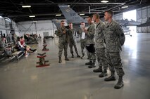 U.S. Air Force Airmen with the 79th Aircraft Maintenance Unit achieve the fastest weapons load time during a quarterly load crew competition at Shaw Air Force Base, S.C., April 6, 2012.  These Airmen loaded several inert munitions onto an F-16 Fighting Falcon.(U.S. Air Force photo by Airman Nicole Sikorski/Released)