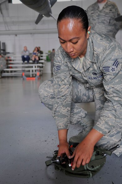 U.S. Air Force Senior Airman Hanalei Iuta, 55th Aircraft Maintenance Unit weapons specialist, prepares tools used to aid Airmen when loading inert munitions onto an F-16 Fighting Falcon at Shaw Air Force Base, S.C., April 6, 2012.  Iuta along with other Airman were competing in a quarterly load crew competition.(U.S. Air Force photo by Airman Nicole Sikorski/Released)