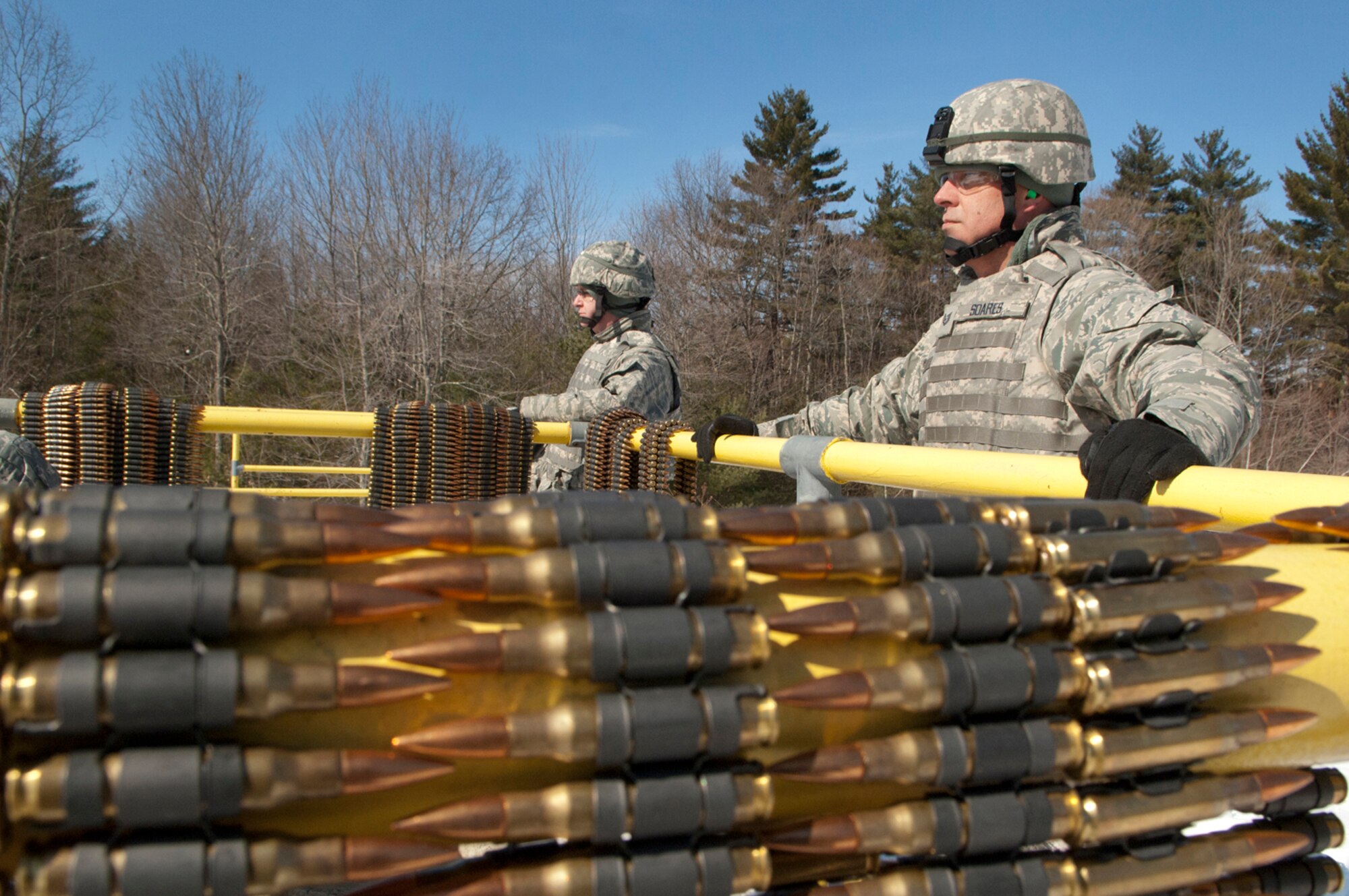 FORT DEVENS, Mass. -- (left to right) Airman 1st Class Jason Bryant and
Tech. Sgt. Philip Soares, 157th Security Forces Squadron, look on as
squadron personnel fire on the M240B and M249 weapon systems on the range
here Mar. 5.  (National Guard photo by Tech. Sgt. Mark Wyatt/RELEASED)
