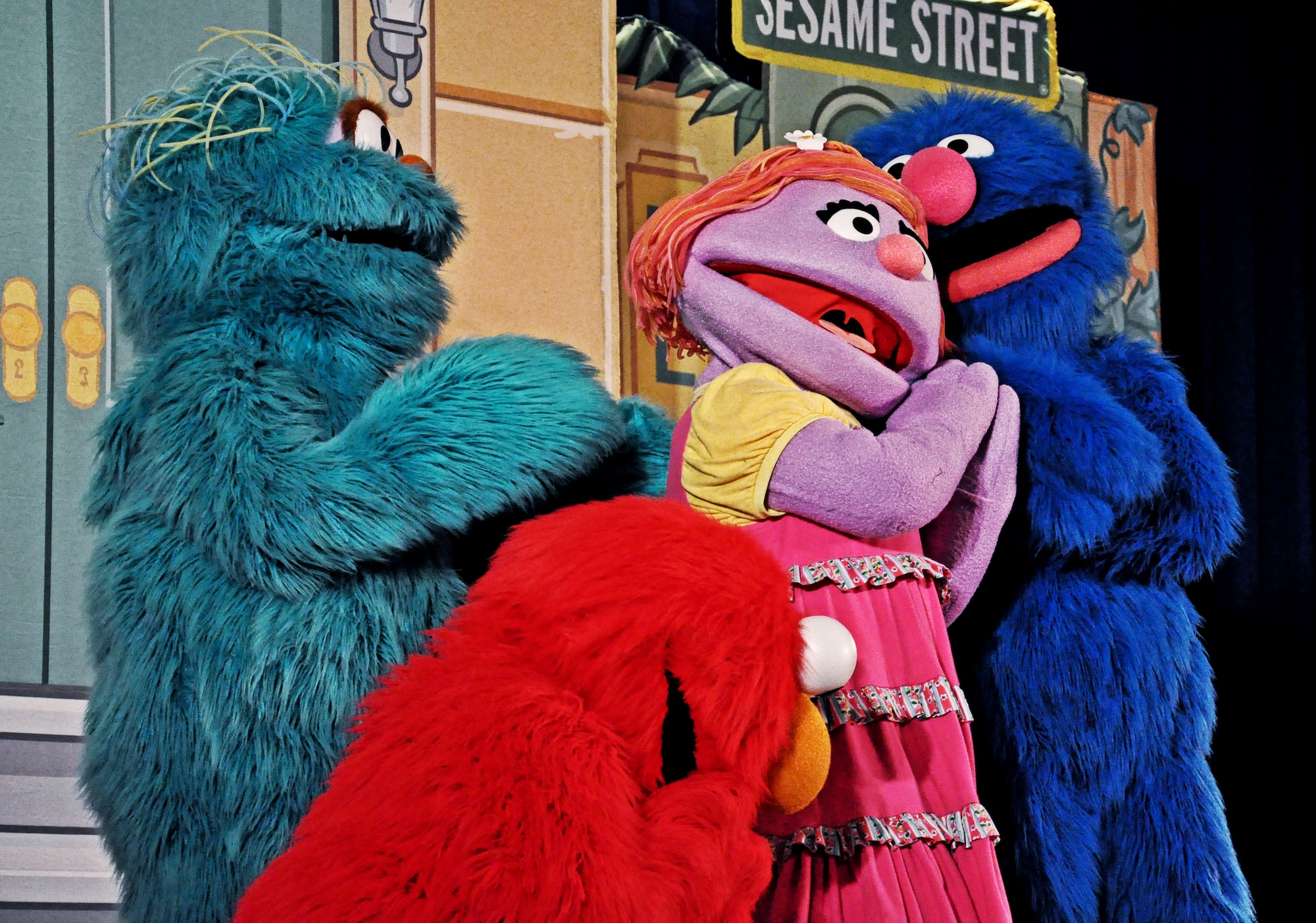 The cast of Sesame Street dance and sing about staying positive at the base theater at Scott Air Force Base, Ill., April 7, 2012. The play focuses on the children of the military by introducing a new character, Katie, and having her open up about her fears and excitement as she deals with moving to a new place and making new friends. (U.S. Air Force photo/Airman 1st Class Jake Eckhardt)
