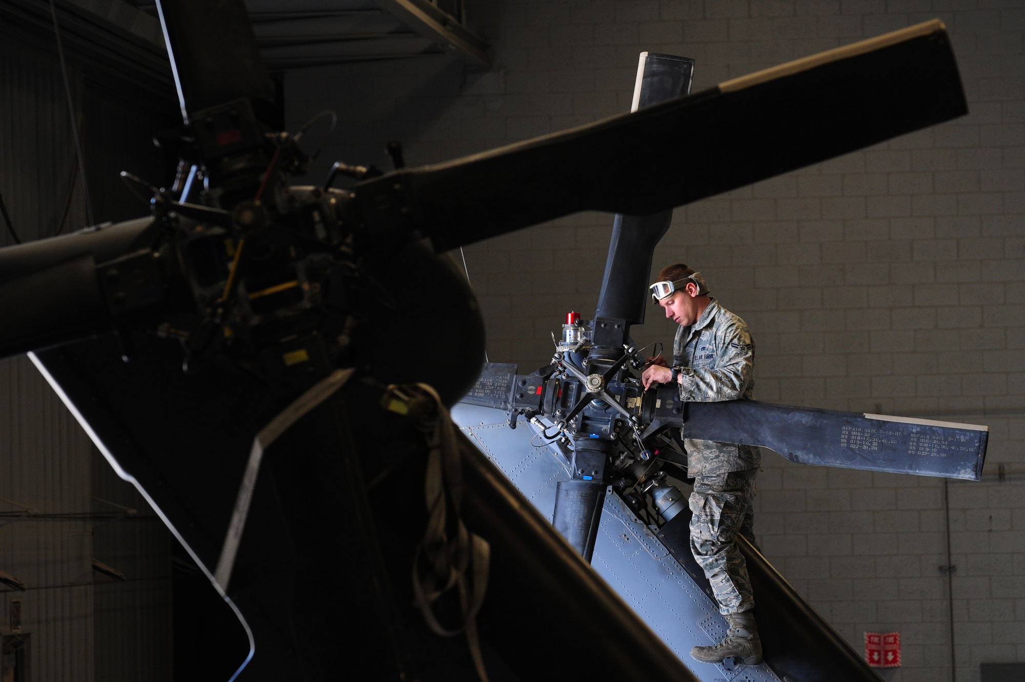 U.S. Air Force Airman 1st Class Tevor Pistekt, 763rd Maintenance Squadron crew chief, performs maintenance on the tail rotor of an HH-60 Pave Hawk helicopter April 9, 2012 at Nellis Air Force Base, Nev.  The 763rd Maintenance Squadron will change to the 823rd Maintenance Squadron effective April 10, 2012.  (U.S. Air Force photo by Staff Sgt. William P.Coleman)
  


