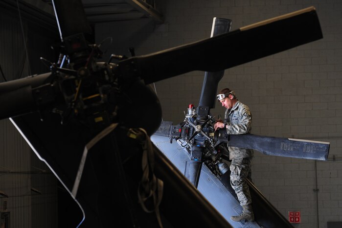 U.S. Air Force Airman 1st Class Tevor Pistekt, 763rd Maintenance Squadron crew chief, performs maintenance on the tail rotor of an HH-60 Pave Hawk helicopter April 9, 2012 at Nellis Air Force Base, Nev.  The 763rd Maintenance Squadron will change to the 823rd Maintenance Squadron effective April 10, 2012.  (U.S. Air Force photo by Staff Sgt. William P.Coleman)  