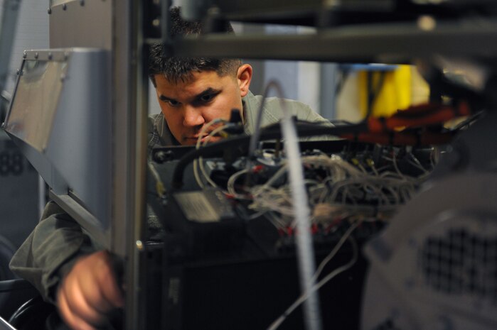 U.S. Air Force Staff Sgt. Michael Bayer, 763rd Maintenance Squadron aerospace ground equipment craftsman, conducts preventative maintenance on a A/M32A-86 generator April 9, 2012 at Nellis Air Force Base, Nev. A/M32A-86 mobile diesel generators are used for providing electrical power to aircraft while being serviced on the flightline.  (U.S. Air Force photo by Staff Sgt. William P.Coleman)  