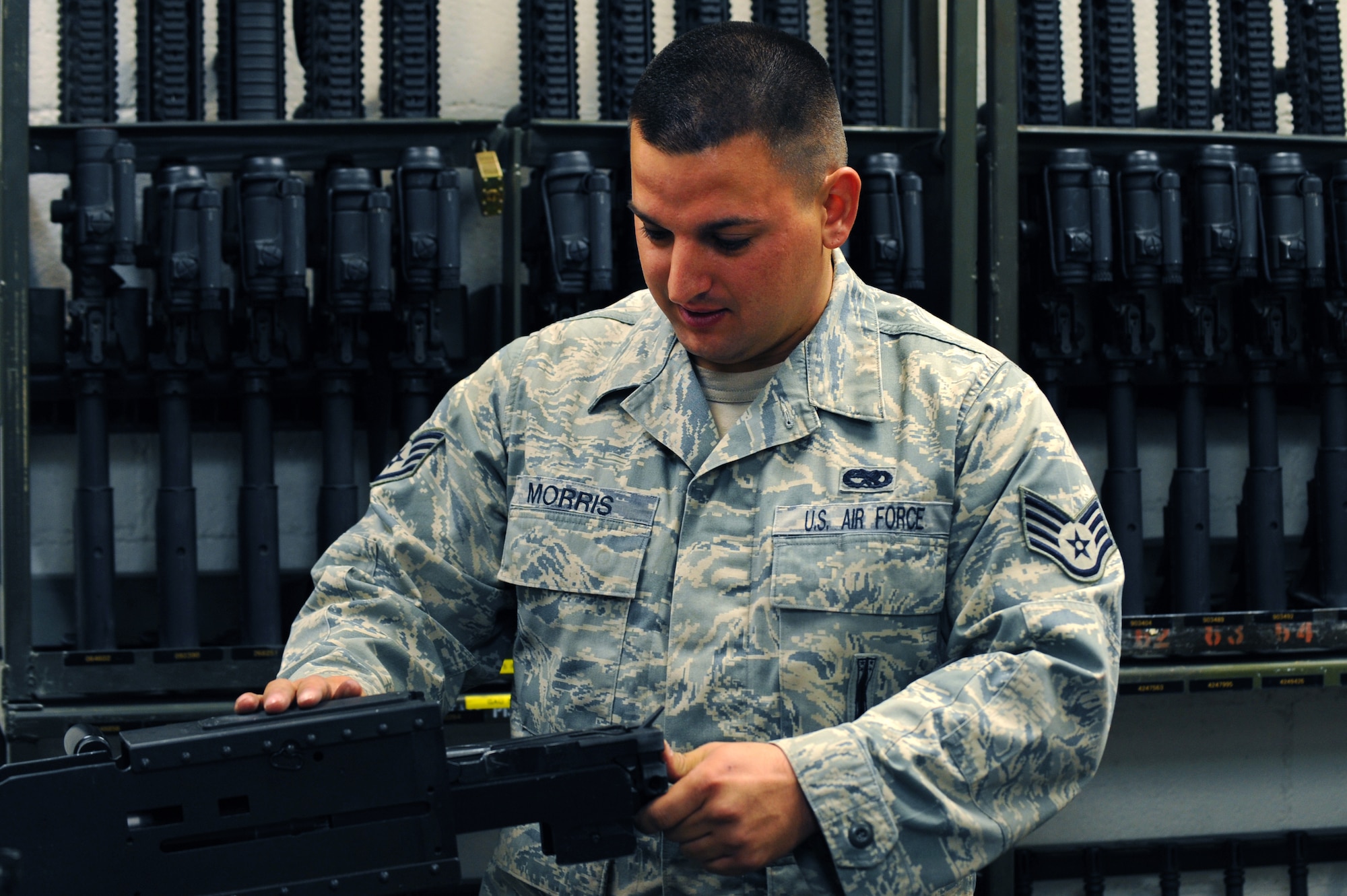 U.S. Air Force Staff Sgt. Daniel Morris, 763rd Maintenance Squadron weapons journeyman,  installs a 50 caliber machine gun firing bolt assembly for use on a HH-60 Pave Hawk helicopter April 6, 2012 at Nellis Air Force Base, Nev. The primary mission of the HH-60G Pave Hawk helicopter is to conduct day or night personnel recovery operations into hostile environments to recover isolated personnel during war.
 (U.S. Air Force photo by Staff Sgt. William P.Coleman)
  


