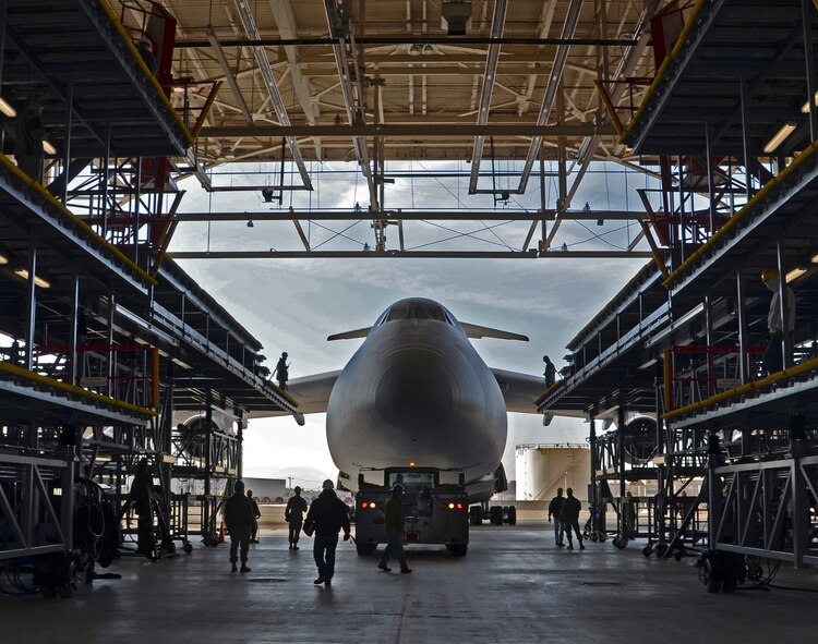 A C-5 Galaxy is towed into new Regional Isochronal stages that Westover Air Reserve Base, Mass. received this year. Westover continues to be the location -- one of only three in the Air Force -- of a regional isochronal inspection dock responsible for keeping the aircraft in the fight. (U.S. Air Force photo/SrA. Kelly Galloway)