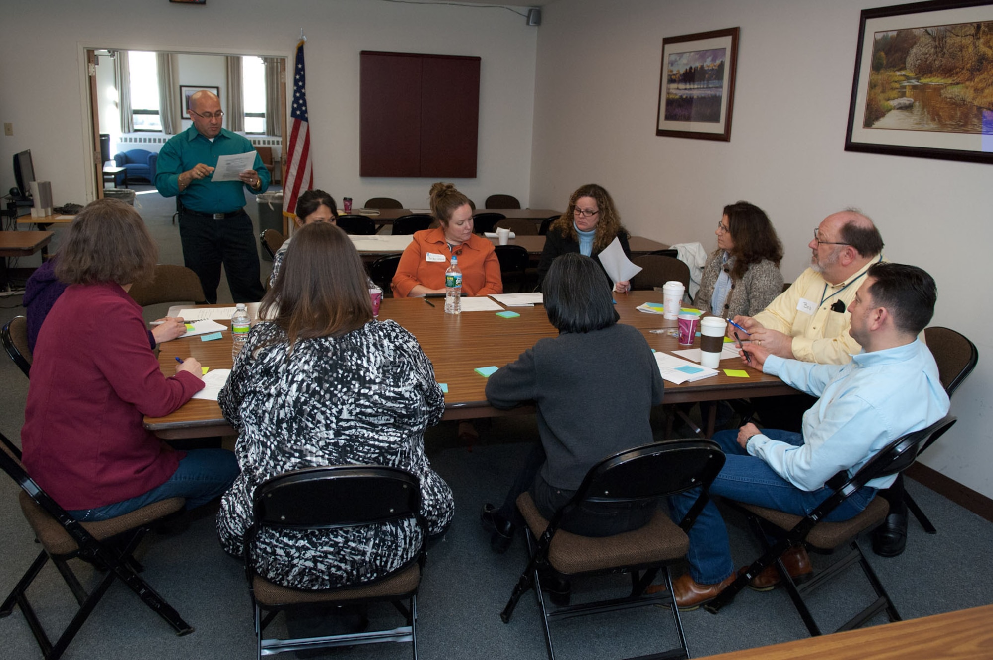 HANSCOM AIR FORCE BASE, Mass. – Participants of the family support focus group, led by facilitator Carlos Alicea (standing), discuss ideas during the Caring for People forum at the Hanscom Conference Center April 3. Throughout the day, dozens of military members, spouses and civilians employees gathered to talk about quality of life and issues that are important to them. (U.S. Air Force photo by Rick Berry)