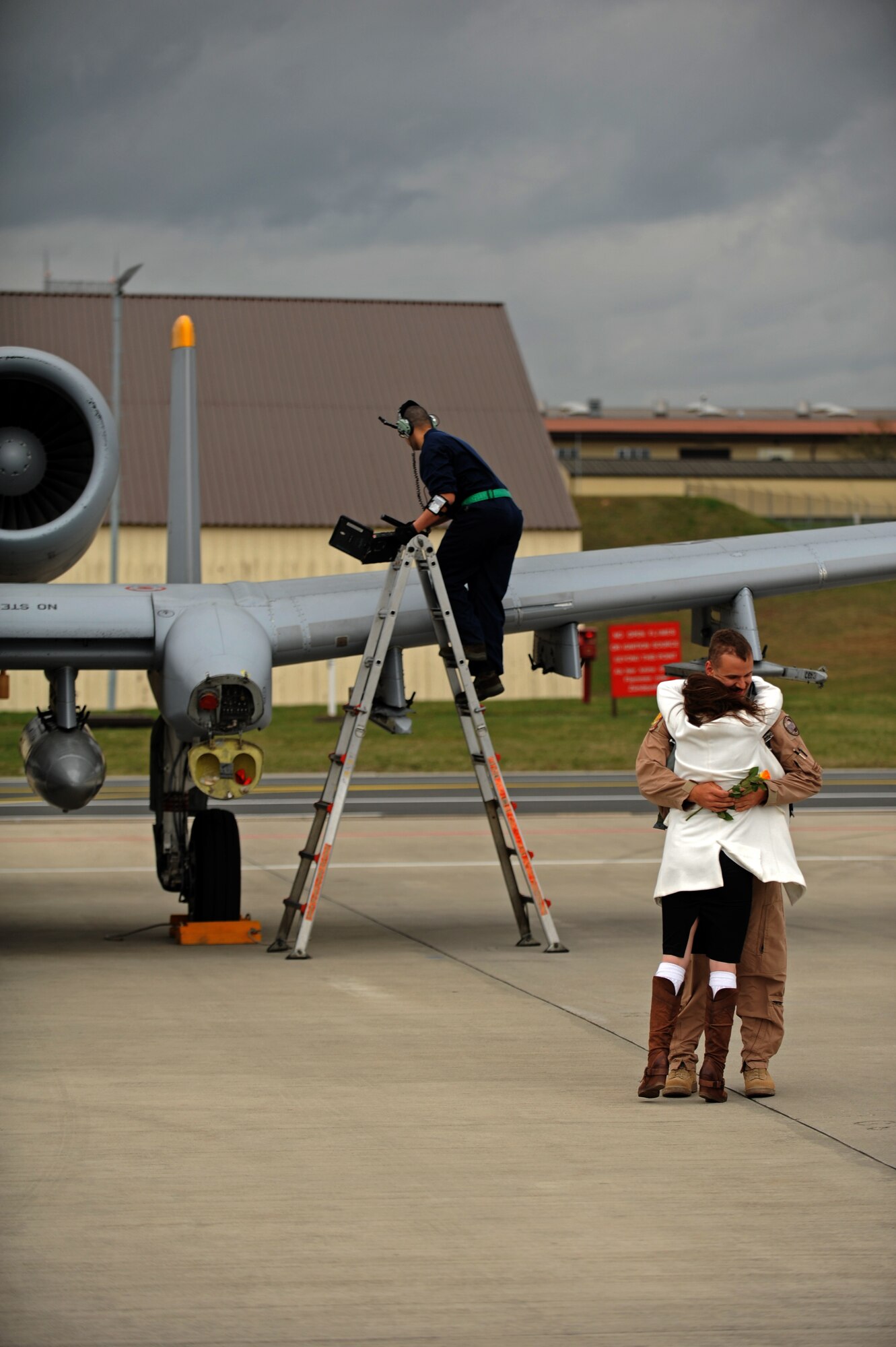 SPANGDAHLEM AIR BASE, Germany – Capt. Michael Dumas, 81st Fighter Squadron pilot and weapons training officer, receives a hug from his wife, Megan, on Ramp 4 here April 10. Dumas was one of the squadron’s six pilots returning from a deployment from Bagram Airfield, Afghanistan, providing close air support during Operation Enduring Freedom. (U.S. Air Force photo by Airman 1st Class Matthew B. Fredericks/Released)