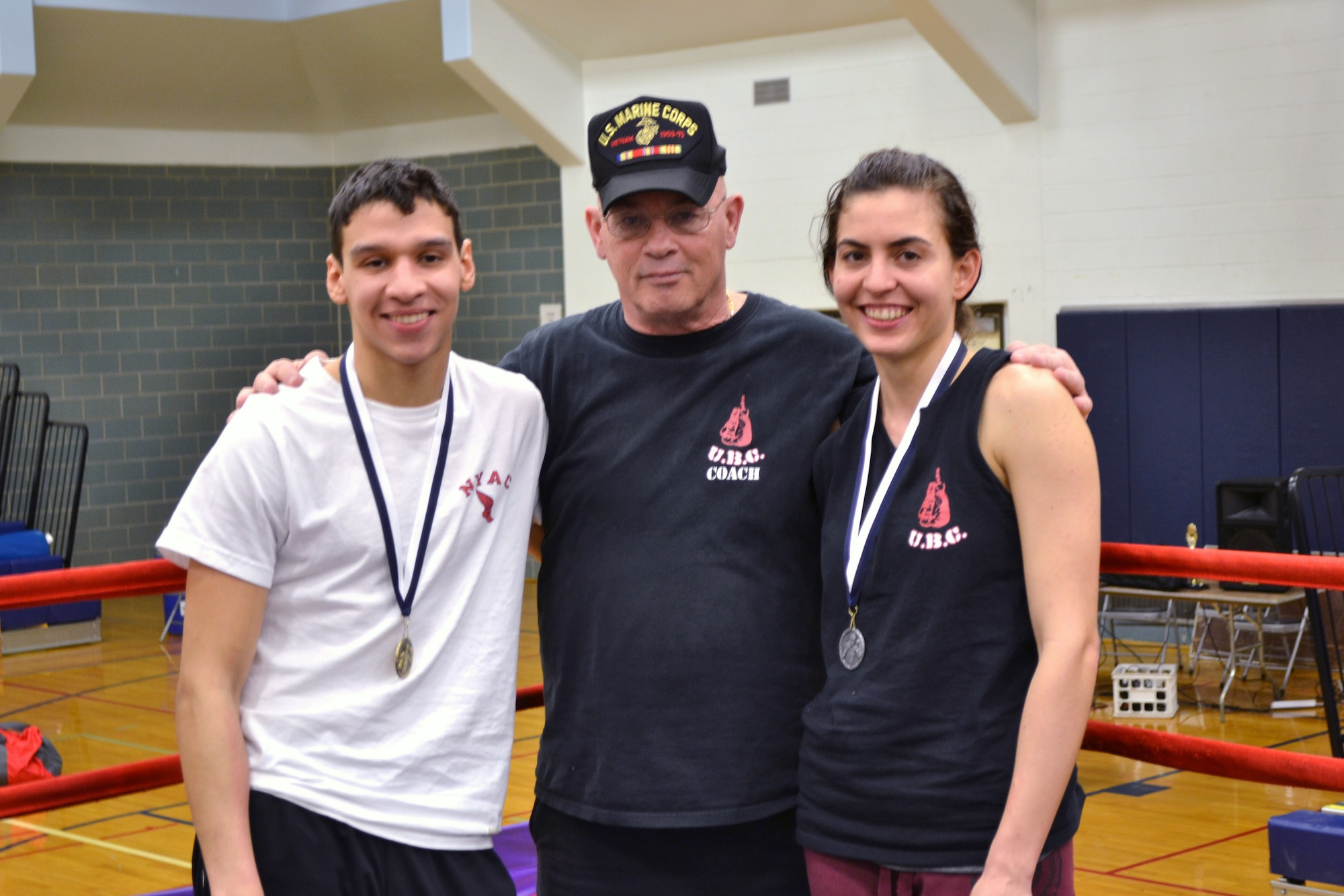 Coach Rocky Snow with Joshue Lopez and Eydis Lima, 125lbs who came in second in the Regional Championship in the woman's division. 