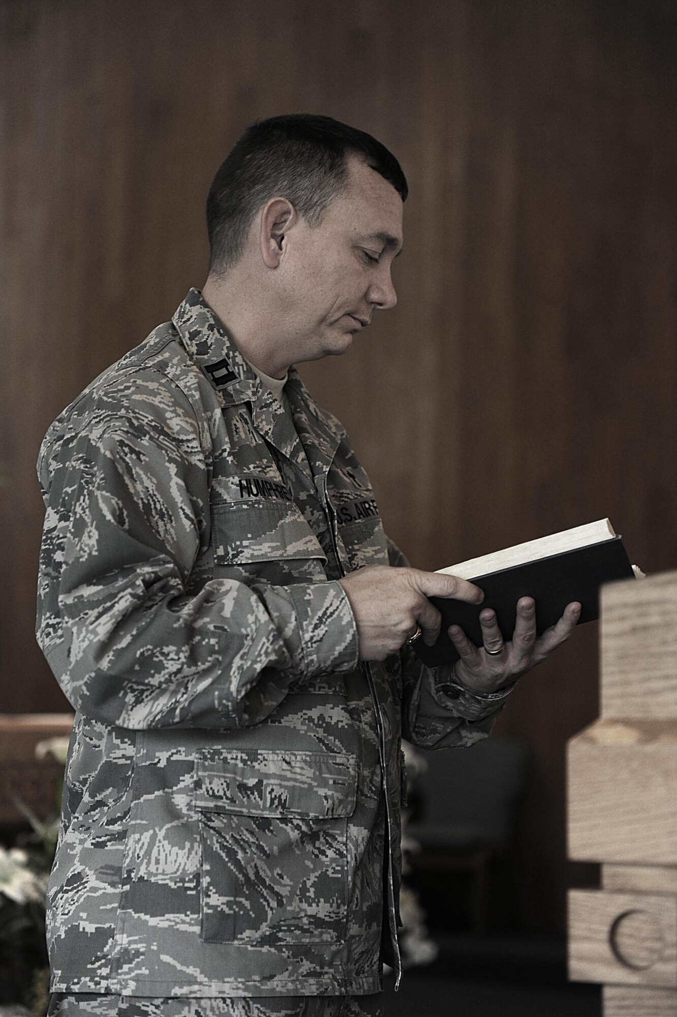U.S. Air Force Chaplain (Capt.) Kevin Humphrey reads from the Bible during a service on Kadena Air Base, April 3, 2012. Humphrey is a recent recipient of the 2011 Air Force Company Grade Officer of the year award. (U.S. Air Force photo by Airman 1st Class Brooke P. Beers/Released)