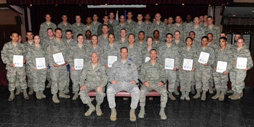 Forty-four recently promoted staff sergeants pose for a group photo after the quarterly NCO induction ceremony on Kadena Air Base, Japan, April 4, 2012. The staff sergeants participated in a seminar prior to the graduation where they attended the base’s first joint service leadership panel. (U.S. Air Force photo by Junko Kinjo/Released)