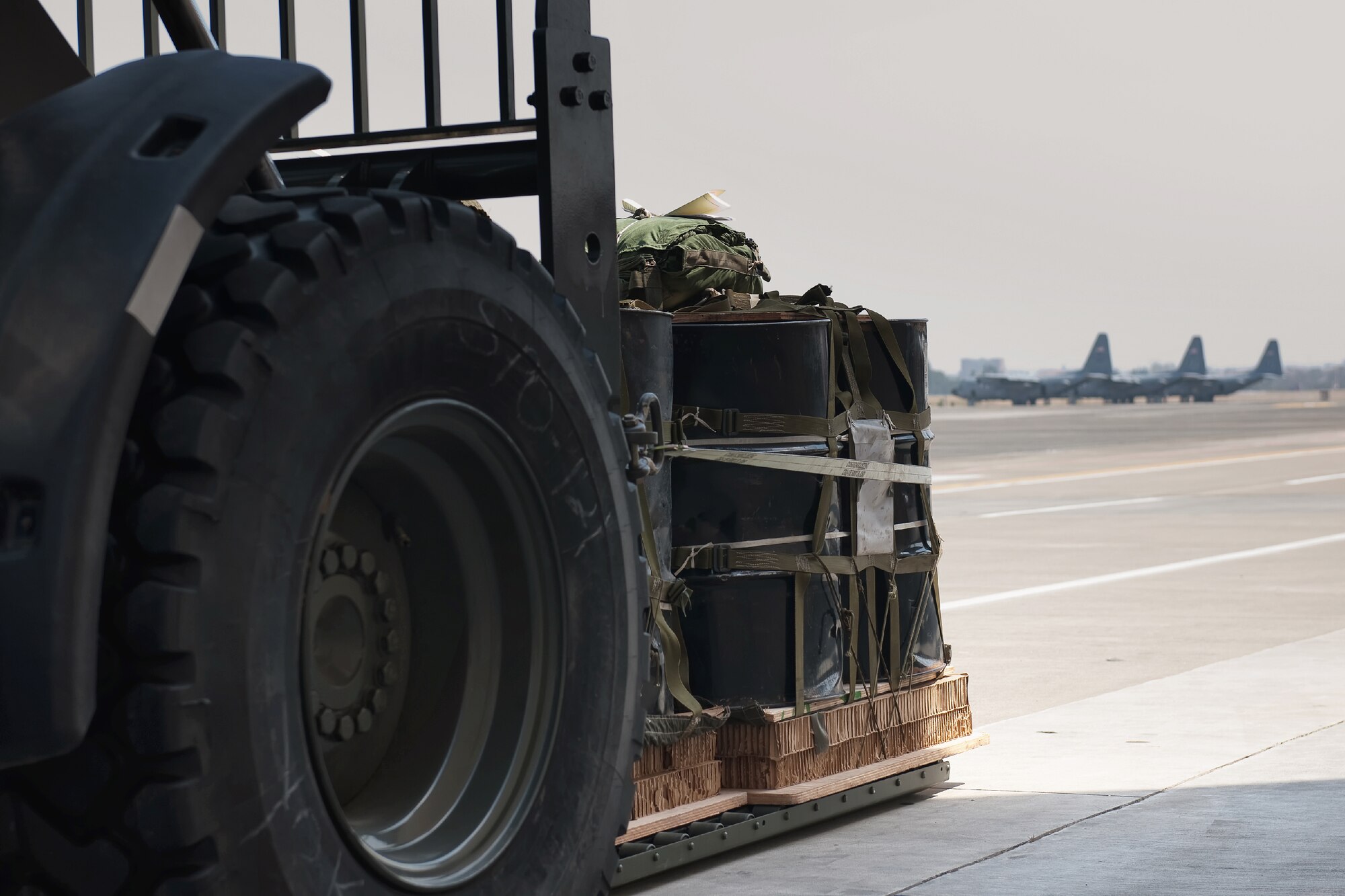 YOKOTA AIR BASE, Japan -- Loaded a container delivery bundles on a 10K forklift waits for loading onto a C-130 Hercules at Yokota Air Base, Japan, April 10, 2012. Airmen from the 374th LRS maintains and provides aerial equipments for use during training exercise and real-world deployment. (U.S. Air Force photo/Osakabe Yasuo)