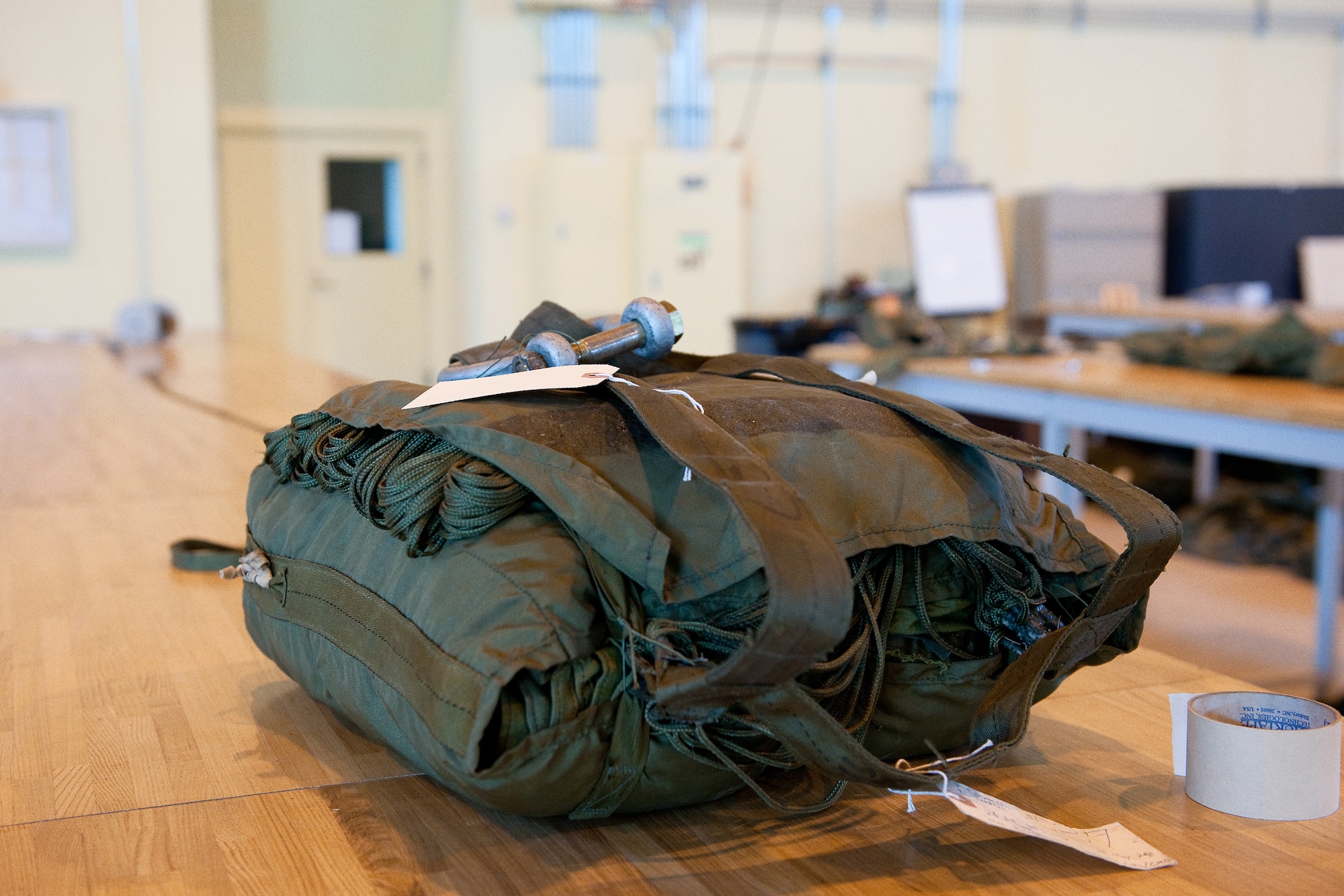 YOKOTA AIR BASE, Japan -- The 374th Logistics Readiness Squadron combat readiness flight prepared a 26-foot high velocity parachute for upcoming airdrop operation at Yokota Air Base, Japan, April 10, 2012. Airmen from the 374th LRS maintains and provides aerial equipments for use during training exercise and real-world deployment. (U.S. Air Force photo/Osakabe Yasuo)