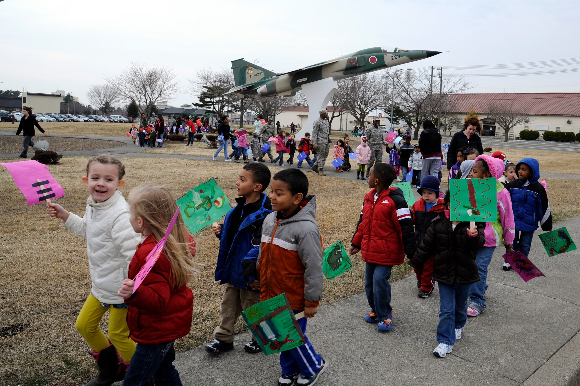 Parents, children and faculty members from the Yoiko Child Development Center walk around the Air Park during their "March with Pride" fun walk at Misawa Air Base, Japan, April 11, 2012. The Month of the Military Child is a time to recognize the contributions, sacrifices and stressors military children endure. (U.S. Air Force photo by Tech. Sgt. Marie Brown/Released)
