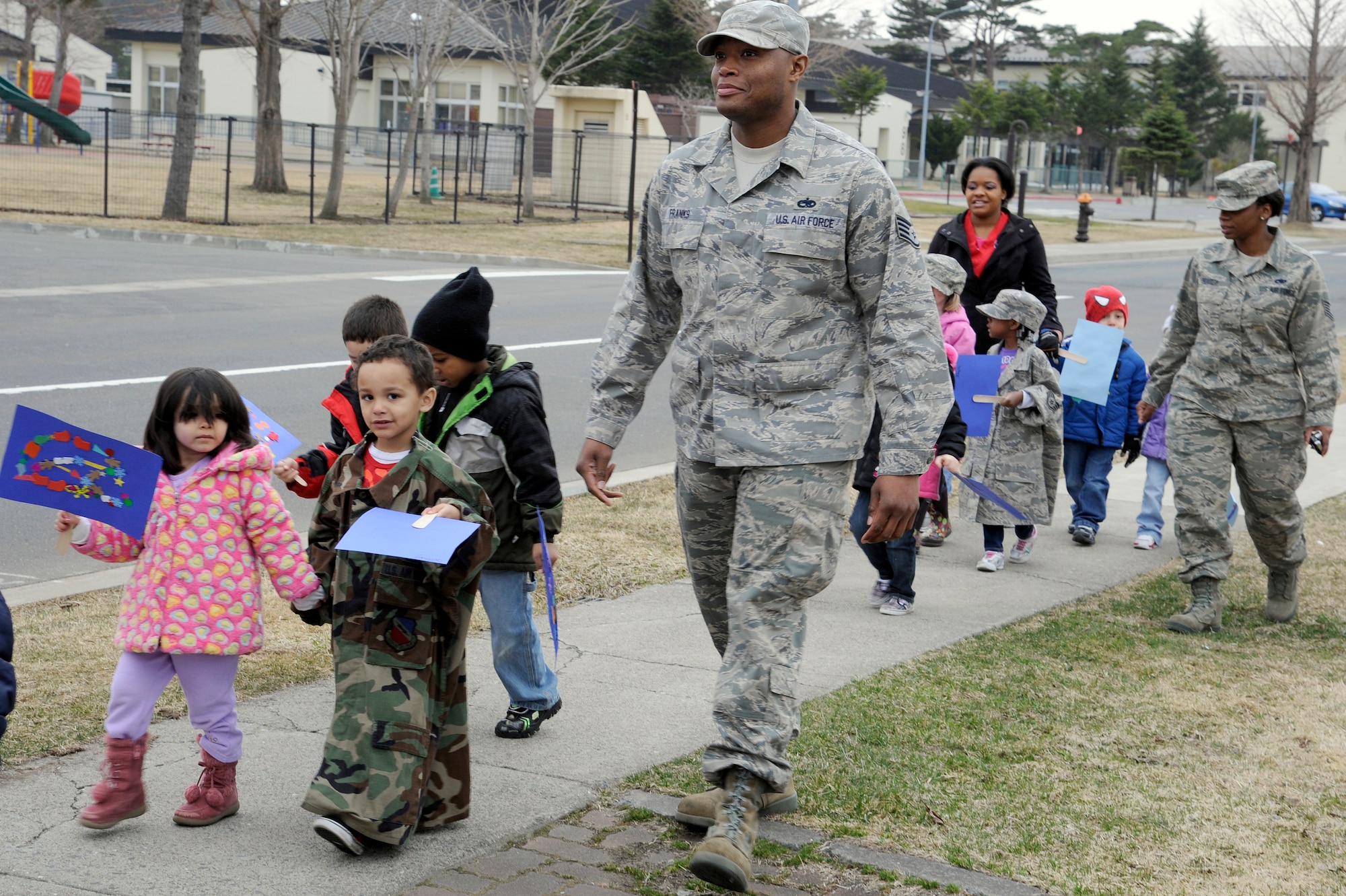 Parents, children and faculty members from the Yoiko Child Development Center participate in the "March with Pride" fun walk at Misawa Air Base, Japan, April 11, 2012. This is the second year the CDC has done this march in support of The Month of the Military Child. (U.S. Air Force photo by Tech. Sgt. Marie Brown/Released)
