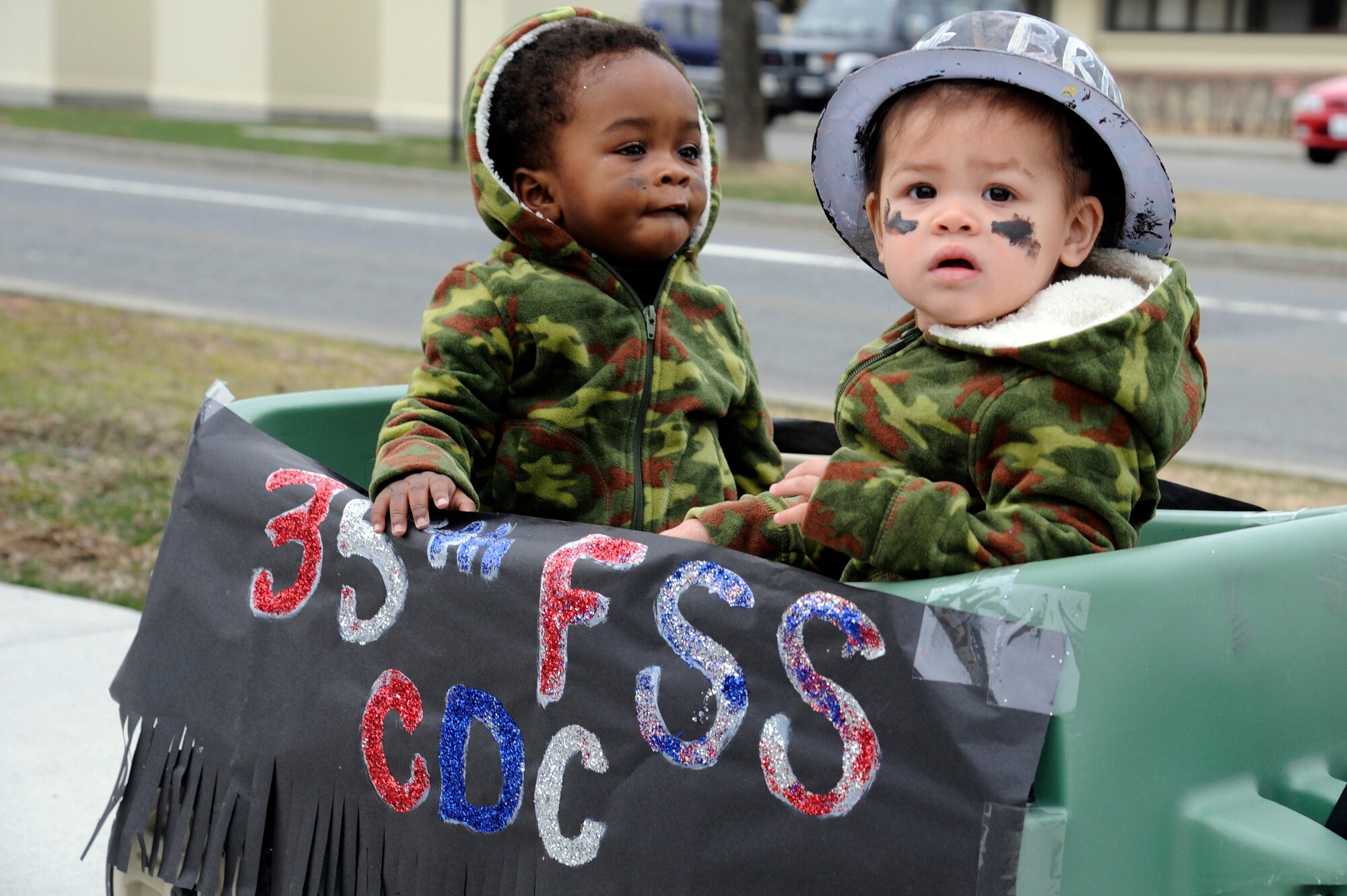 Children from the Yoiko Child Development Center show their military pride as they participate in the "March with Pride" fun walk at Misawa Air Base, Japan, April 11, 2012. April is designated as The Month of the Military Child and was established to recognize the essential role that military child care services and youth activities play in fostering readiness and enhancing the quality of life of military families. (U.S. Air Force photo by Tech. Sgt. Marie Brown/Released)
