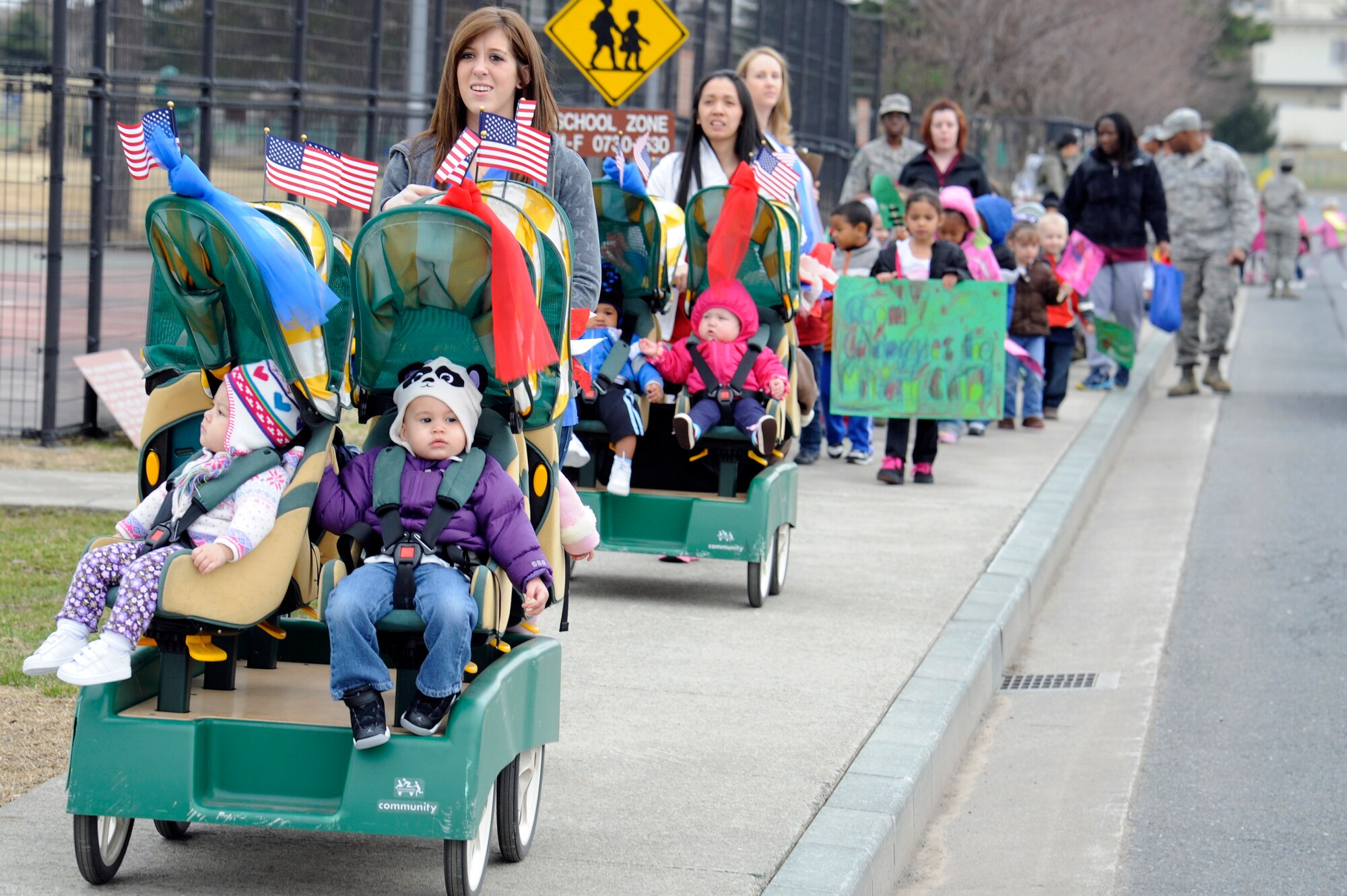 Parents, children and faculty members from Yoiko Child Development Center participate in the "March with Pride" fun walk at Misawa Air Base, Japan, April 11, 2012. The CDC celebrated The Month of the Military Child by having participants walk from the CDC to the Air Park and back as they showed their support for the military child. (U.S. Air Force photo by Tech. Sgt. Marie Brown/Released)
