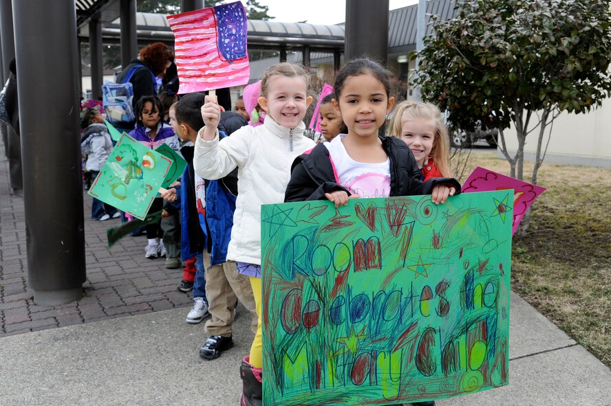Children from the Yoiko Child Development Center hold up signs as they prepare for the "March with Pride" fun walk at Misawa Air Base, Japan, April 11, 2012. The march was part of The Month of the Military Child celebration and gave some children the opportunity to dress in military clothing to show their military pride. (U.S. Air Force photo/Tech. Sgt. Marie Brown/Released) 
