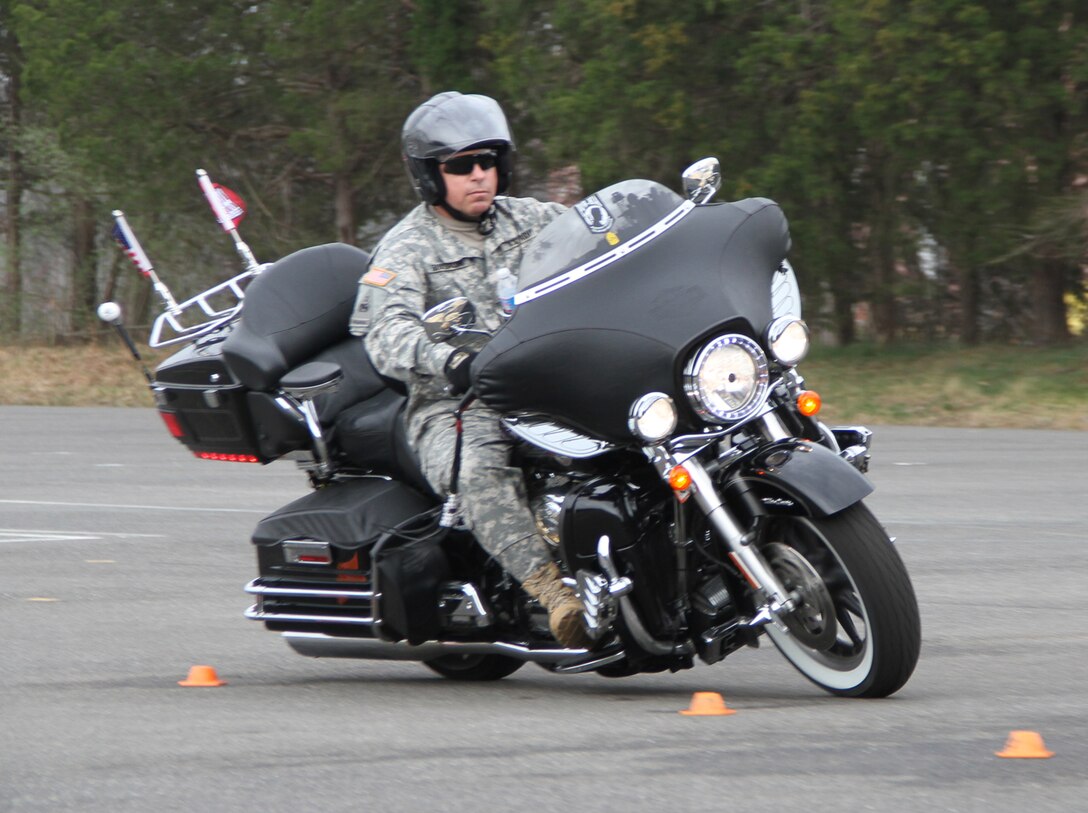QUANTICO, Va. — Command Sgt. Maj. Michael Buxbaum, command sergeant major of the U.S. Army Corps of Engineers, maneuvers his Harley-Davidson Ultra Classic through an S-curve during the Basic Riders Course II March 16 at Marine Corps Base Quantico.