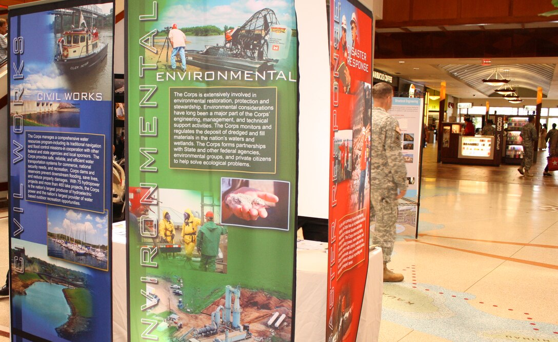 Honolulu District Commander LTC Douglas Guttormsen, Chief of Construction Lou Muzzarini, and Chief of Engineering and Construction Todd Barnes visit the District's Engineers Week display at the Pearlridge Mall on Thursday, February 23, 2012.