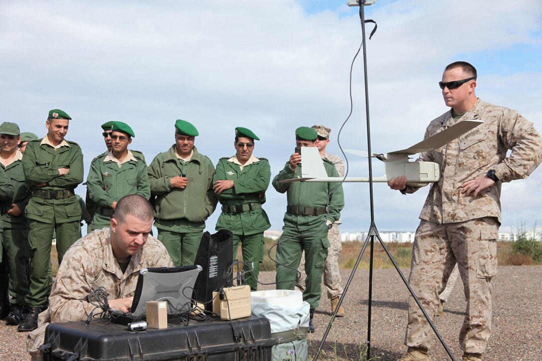 Lance Cpl. Richard Hager, left, an intelligence analyst, and Cpl. Kursten French, a scout sniper radio operator, both with Battalion Landing Team 1st Battalion, 2nd Marine Regiment, 24th Marine Expeditionary Unit, make last minute preparations on an RQ-11B Raven Unmanned Aerial System before a demonstration flight for members of the Royal Moroccan Armed Forces in support of Exercise African Lion here, April 12, 2012. African Lion is a bi-lateral training exercise between U.S. forces, including the 24th MEU, and Royal Moroccan Armed Forces to promote partnership and mutual understanding between each nation's militaries. The 24th MEU, along with the Iwo Jima Amphibious Ready Group, is currently deployed as a theater security and crisis response force capable of a variety of mission from full-scale combat to humanitarian assistance and disaster relief.