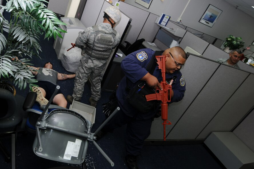 ANDERSEN AIR FORCE BASE, Guam – Members of the 36th Security Forces Squadron prepare to search an office after securing the Active Shooter during an exercise April 12. The exercise allows Team Andersen to go through the steps in an Active Shooter scenario under safe conditions. (U.S. Air Force photo by Senior Airman Carlin Leslie)