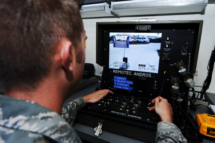ANDERSEN AIR FORCE BASE, Guam – Airman 1st Class Cody Frediani, 36th Civil Engineer Squadron explosive ordinance disposal technician, drives a robot through a control panel during an exercise April 11. The robot that is remotely driven allows EOD to work at a safe distance from the area of concern, while identifying the contents.  (U.S. Air Force photo by Senior Airman Carlin Leslie)

