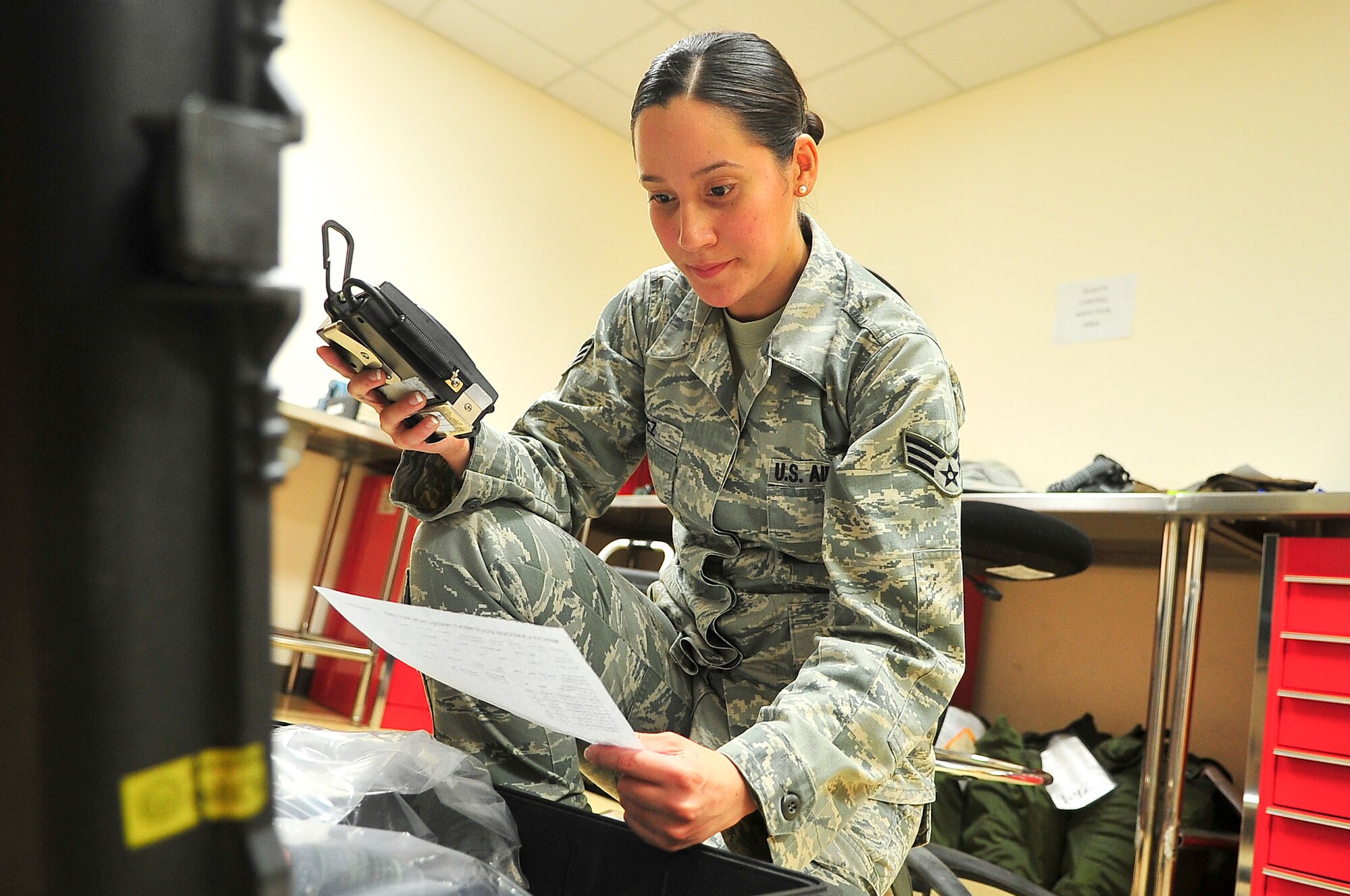 Senior Airman Jennifer Lopez, 51st Operations Support Squadron aircrew flight equipment journeyman, checks all components used in the aircrew chemical defense system April 10, 2012. The defense system is used by pilots who may enter a harmful chemical environment. (U.S. Air Force photo/Senior Airman Adam Grant)