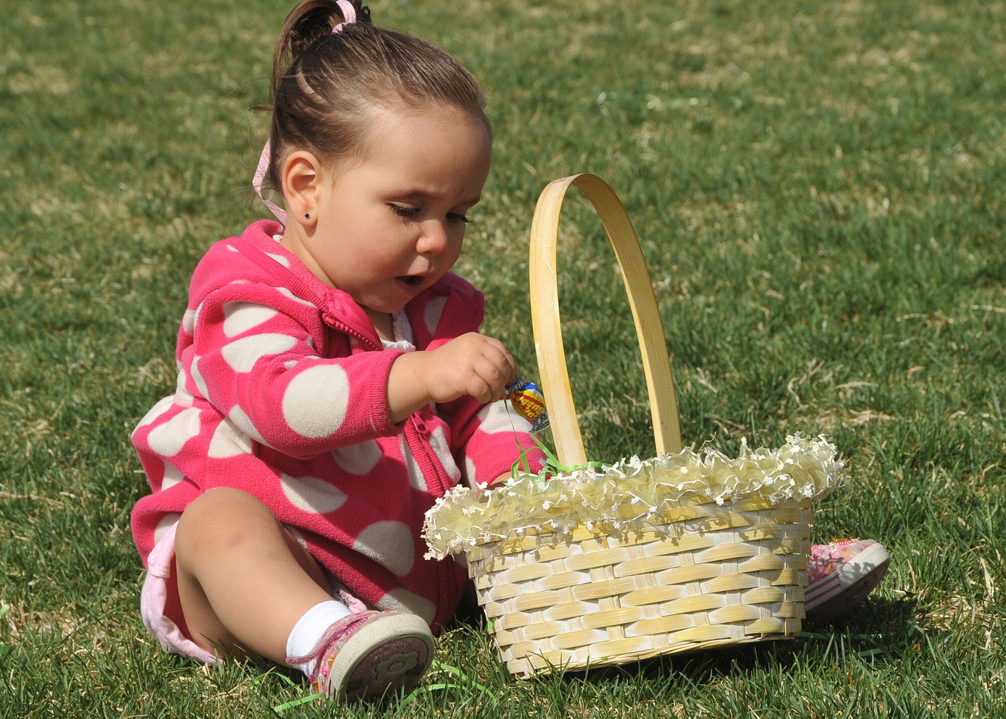 KIRTLAND AFB, N.M. -- More than 100 children collected hundreds of candy-filled eggs during the Kirtland Air Force Base Easter egg hunt at Hardin Field April 8. Other events included an egg-and-spoon race, a sack race and an appearance by the Easter Bunny. (Photo by Todd Berenger)