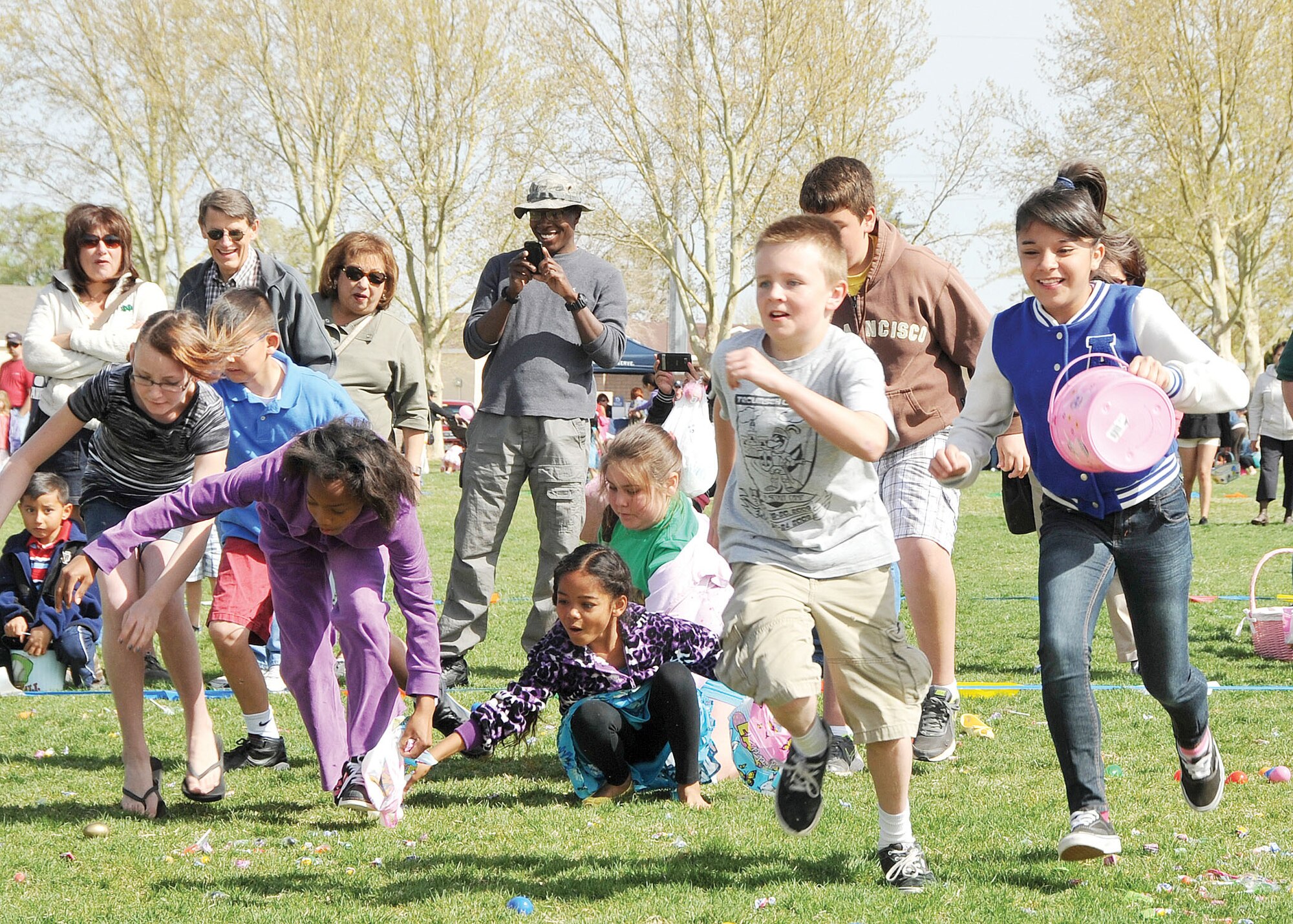 KIRTLAND AFB, N.M. -- More than 100 children collected hundreds of candy-filled eggs during the Kirtland Air Force Base Easter egg hunt at Hardin Field April 8. Other events included an egg-and-spoon race, a sack race and an appearance by the Easter Bunny. (Photo by Todd Berenger)