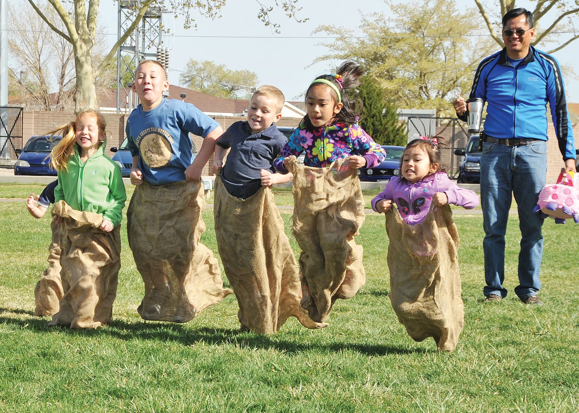 KIRTLAND AFB, N.M. -- During the Easter egg hunt at Hardin Field April 8, children participated in a sack race. Other events included an egg-and-spoon race, a sack race and an appearance by the Easter Bunny. More than 100 children collected hundreds of candy-filled eggs during event. (Photo by Todd Berenger)