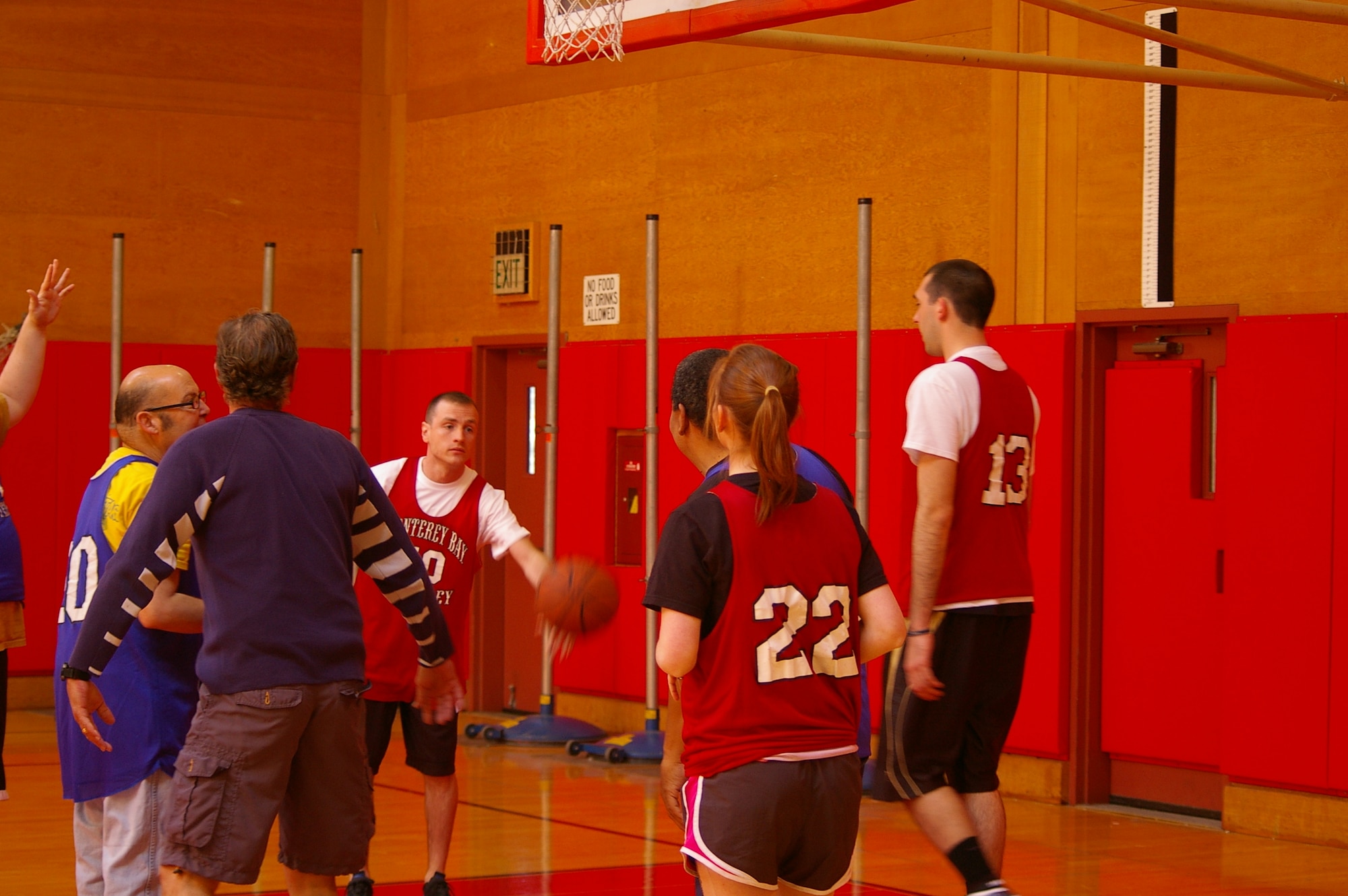 PRESIDIO OF MONTEREY, Calif -- Airmen from the 311th Training Squadron, 517th Training Group, Presidio of Monterey, Calif., work with Special Olympics members, during basketball training recently. The practice sessions earned the team a “Silver” medal during the Northern California Special Olympics last month. (Courtesy photo)