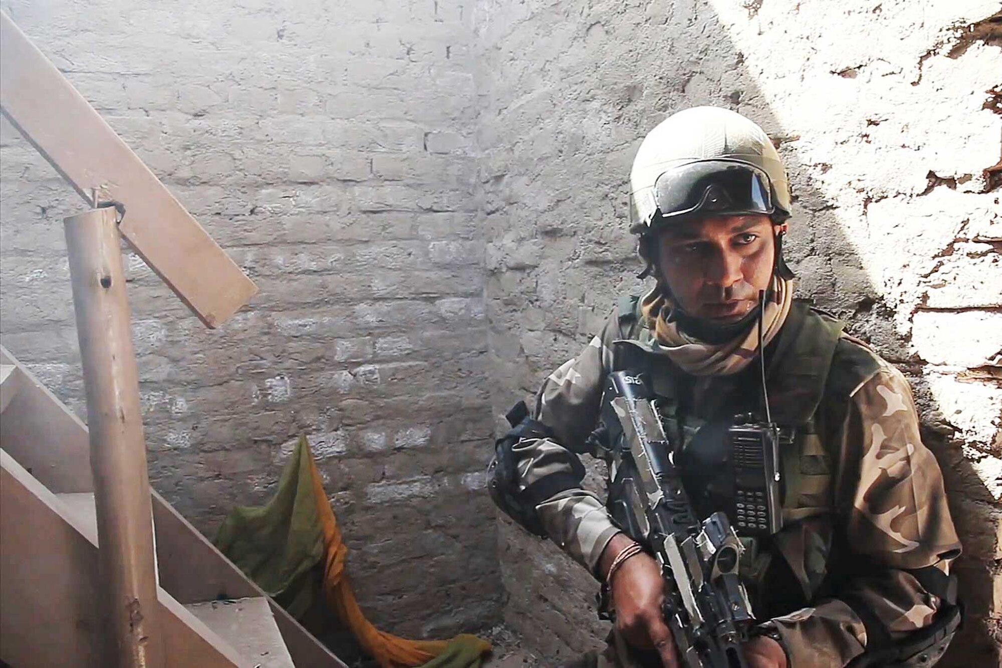 An Indian Army soldier takes a quick breath during live-fi re training, which was part of Yudh Abhyas 2012. Soldiers of 2nd Engineer Brigade participated in the exercise with their Indi an counterparts of 471 Combat Engineer Brigade. (U.S. Army video still/Staff Sgt. Robert Ham)