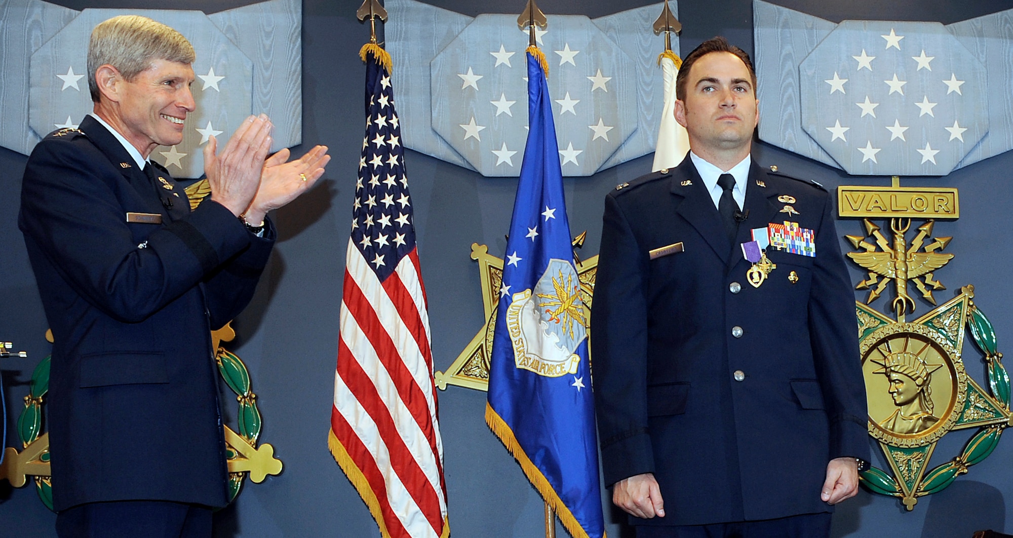 Air Force Chief of Staff Gen. Norton Schwartz congratulates Capt. Barry Crawford after presenting him with the Air Force Cross and Purple Heart during a ceremony in the Pentagon's Hall of Heroes in Washington, D.C., on April 12, 2012.  (U.S. Air Force photo/Andy Morataya)