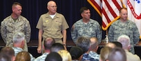 U.S. Marine Corps Lt. Col. Jeff Hanson, Joint Electronic Warfare Center, Joint Base San Antonio-Lackland, joins Navy Rear Adm. William Kiser, Medical Education and Training Campus commandant, JBSA-Fort Sam Houston; Army Lt. Gen. William B. Caldwell IV, U.S. Army North commanding general and senior commander, JBSA-Fort Sam Houston and Camp Bullis; and Air Force Col. Scott Peel, 902nd Mission Support Group commander, JBSA-Randolph, as they prepare to sign a Sexual Assault Awareness Month proclamation April 4 at the Roadrunner Community Services building on Fort Sam Houston. The leaders represented the four services during the kickoff of the JBSA SAAM. Peel represented Air Force Gen. Edward A. Rice Jr., Air Education and Training Command commander. (U.S. Army photo by Sgt. Lee Ezzell)