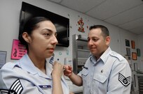 Staff Sgt. Caroline Mejia, 359th Medical Group, receives an immunization from Staff Sgt. Alex FarFan, 359th Medical Group allergy immunization technician, at Joint Base San Antonio-Randolph Clinic April 2. 
(U.S. Air Force Photo by Don Lindsey)