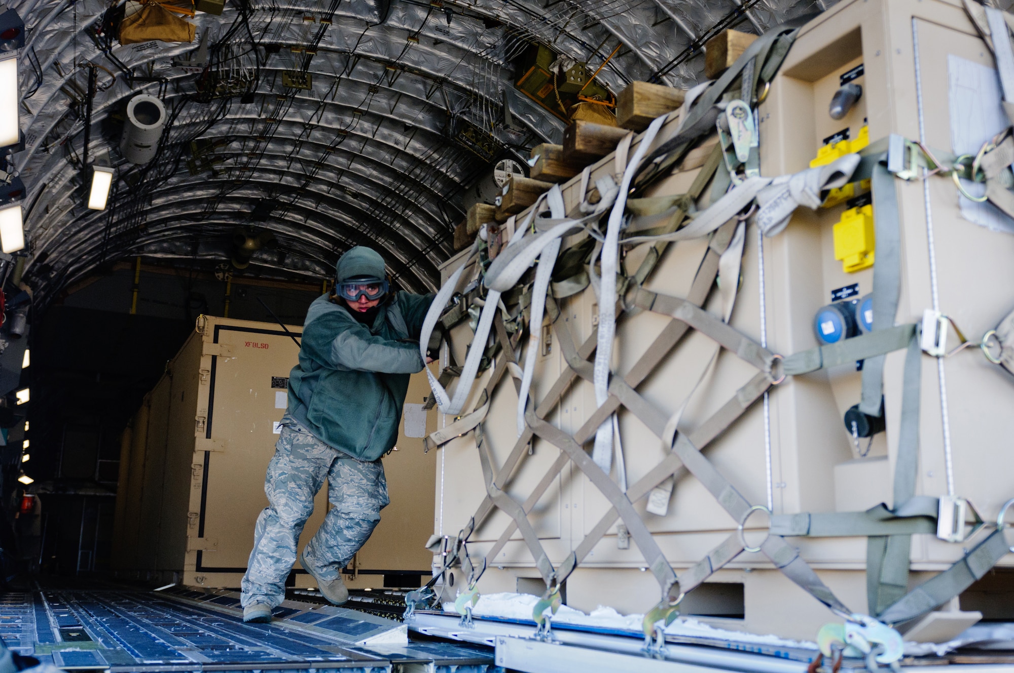 Staff Sgt. Brian Leach, aerial port ramp supervisor for the Kentucky Air National Guard's 123rd Contingency Response Group, pushes a pallet of cargo from a C-17 during Exercise Eagle Flag at Joint Base McGuire-Dix-Lakehurst, N.J., on March 28, 2012. The unit, from Louisville, Ky., joined forces with the U.S. Army's 690th Rapid Port Opening Element from Fort Eustis, Va., to establish a Joint Task Force-Port Opening through March 30. (U.S. Air Force photo by Master Sgt. Phil Speck)