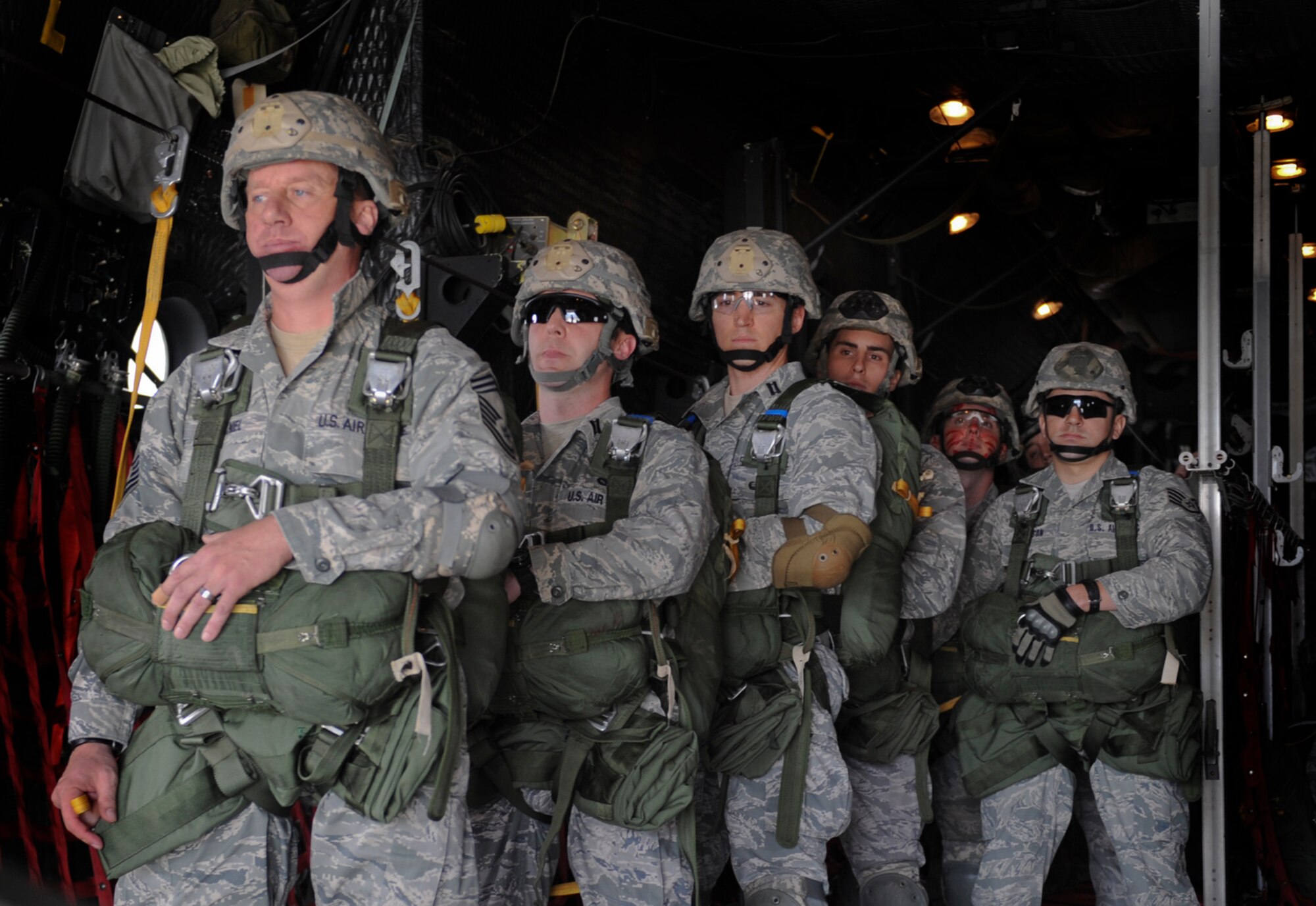 U.S. Air Force Chief Master Sgt. Tommy McDaniel, 820th Base Defense Group, and other 820th BDG members prepare to jump out of an HC-130P Combat King at Moody Air Force Base Ga., March 21, 2012. This was McDaniel’s 15th static line jump. (U.S. Air Force photo by Airman 1st Class Douglas Ellis/Released)
