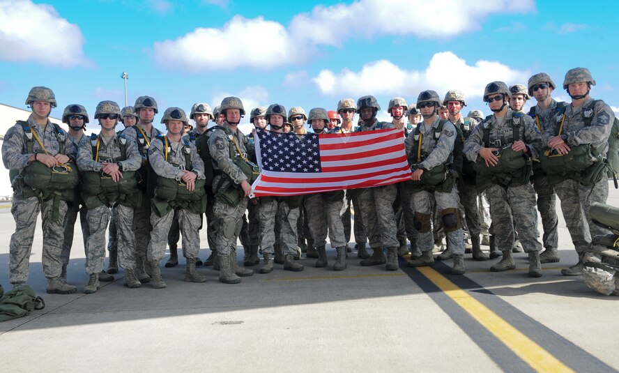 Members of the 820th Base Defense Group pose for a group photo before participating in a static line jump at Moody Air Force Base Ga., March 21, 2012. This was U.S. Air Force Chief Master Sgt. Tommy McDaniel’s last jump before retiring. (U.S. Air Force photo by Airman 1st Class Douglas Ellis/Released)

