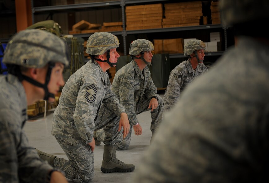 U.S. Air Force Chief Master Sgt. Tommy McDaniel, 820th Base Defense Group, listens to a pre-jump briefing at Moody Air Force Base Ga., March 21, 2012. This briefing will prepare the Airmen for their upcoming jump. (U.S. Air Force photo by Airman 1st Class Douglas Ellis/Released)
