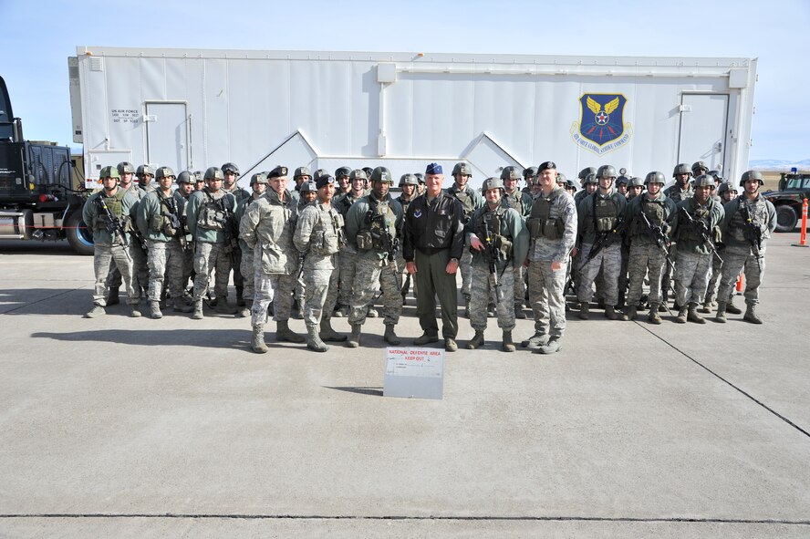 Browne and members of the security forces leadership pose for a group shot with members of the Convoy Response Force, during the general's orientation visit to Malmstrom March 26-29. (U.S. Air Force photo/John Turner)