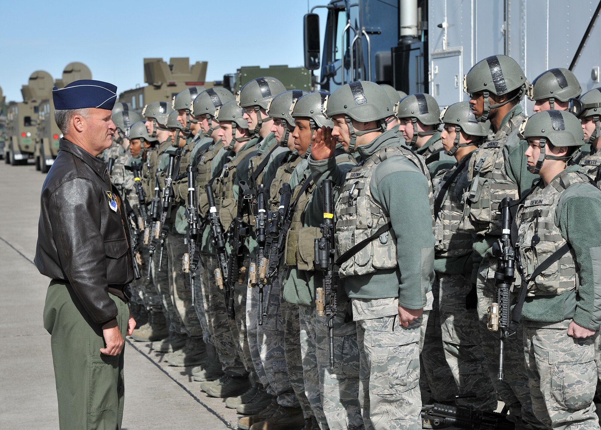 Members of the 741st Missile Security Forces Squadron's Convoy Response Force acknowledge Brig. Gen. James Browne, AFGSC director of Air, Space and Information Operations, during a demonstration they performed for him March 27. (U.S. Air Force photo/John Turner)